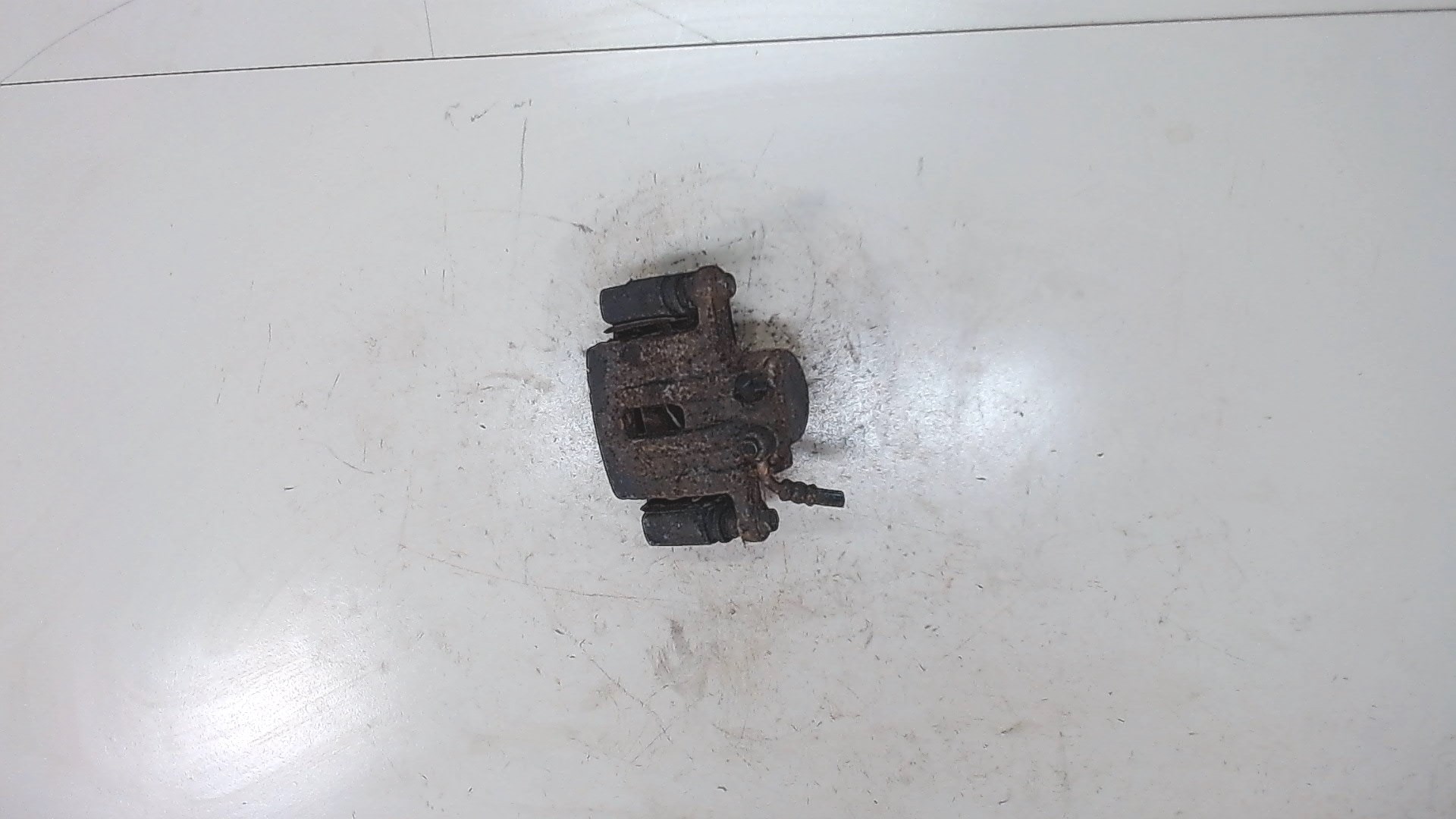 Суппорт задний левый