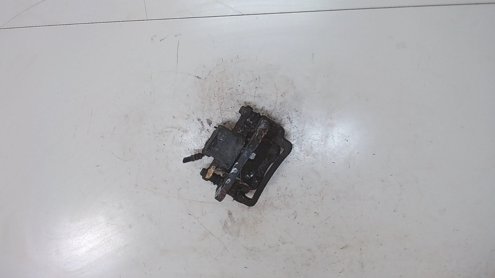 Суппорт задний левый