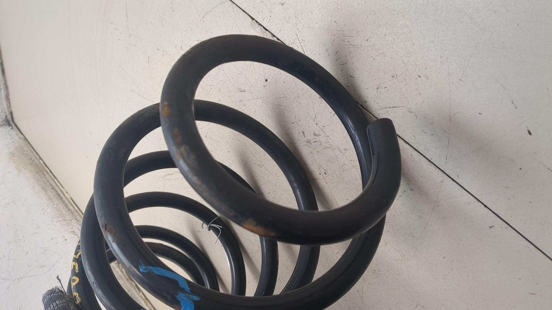 Пружина задняя