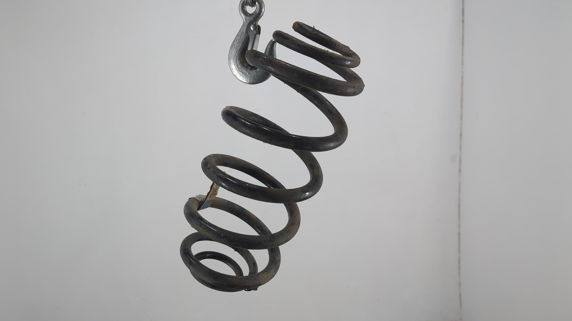 Пружина задняя