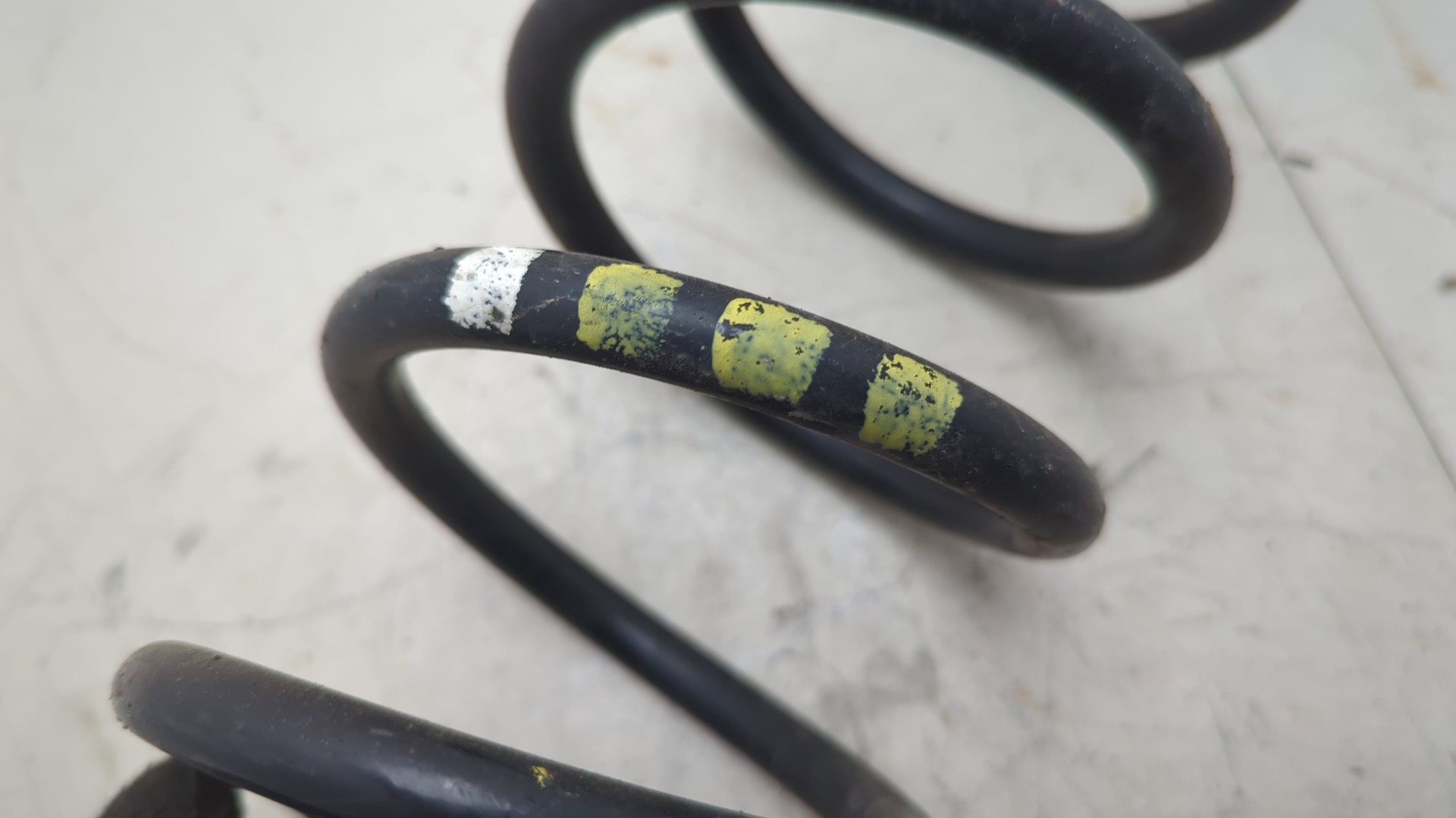 Пружина задняя