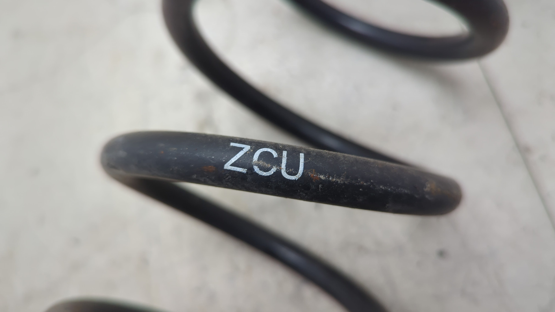 Пружина задняя