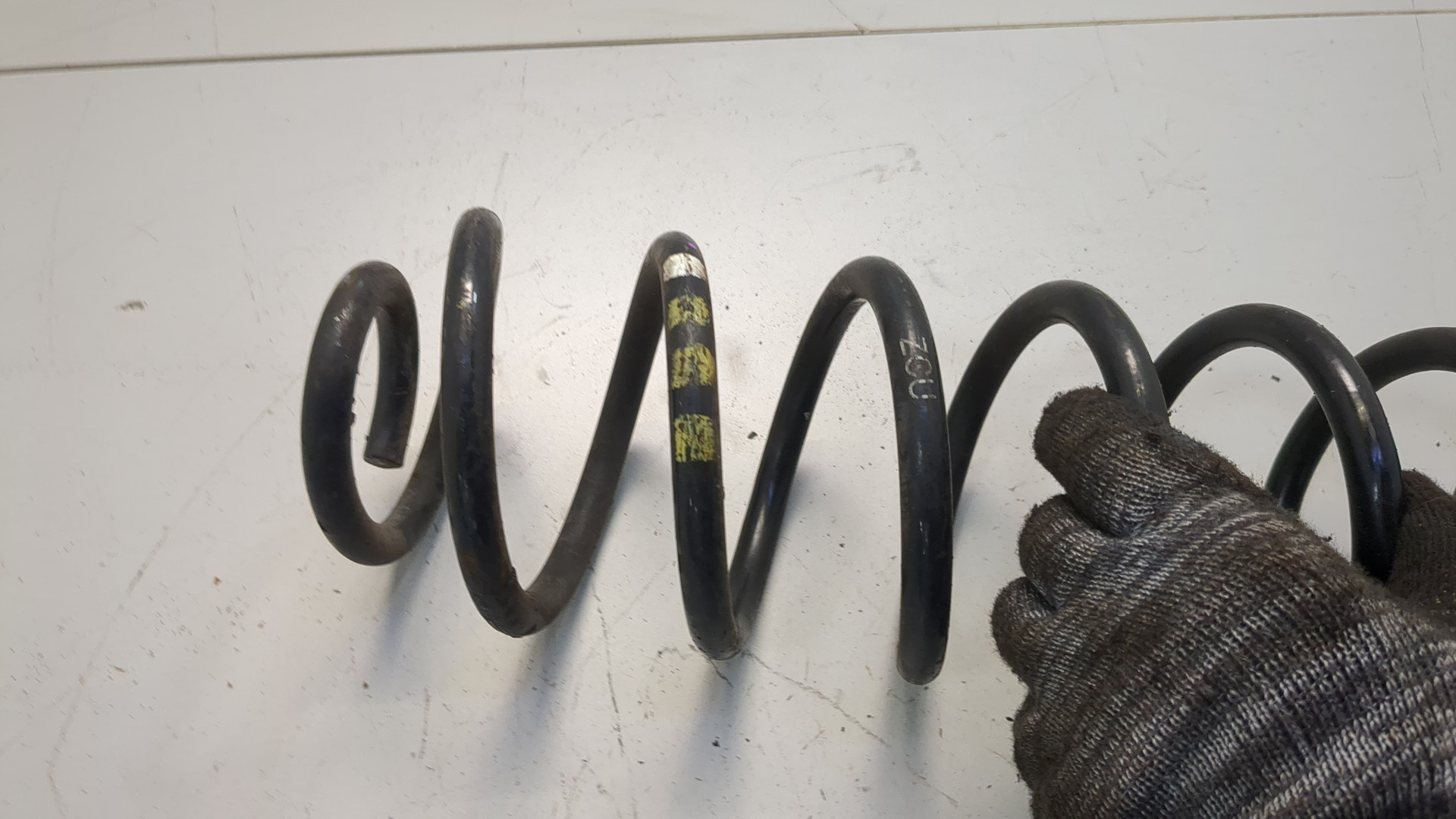 Пружина задняя