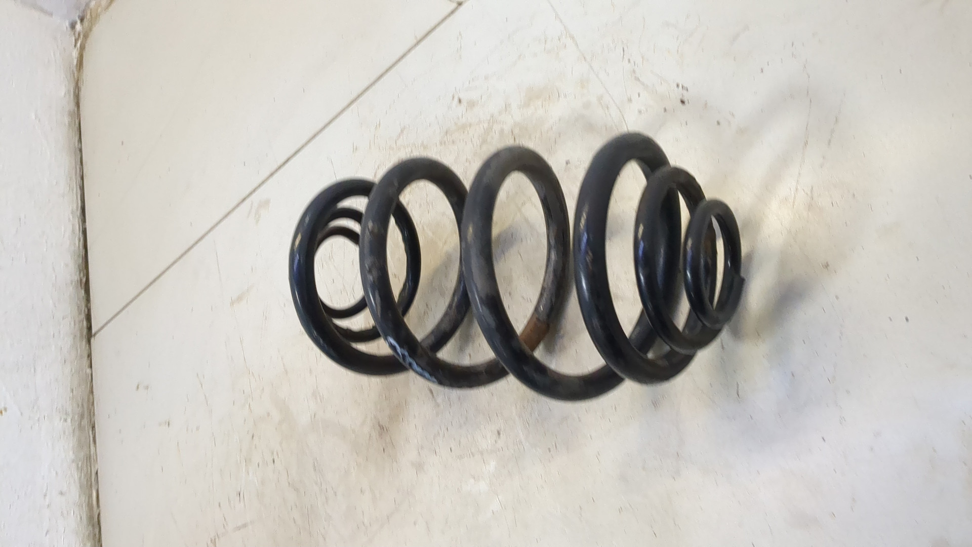 Пружина задняя