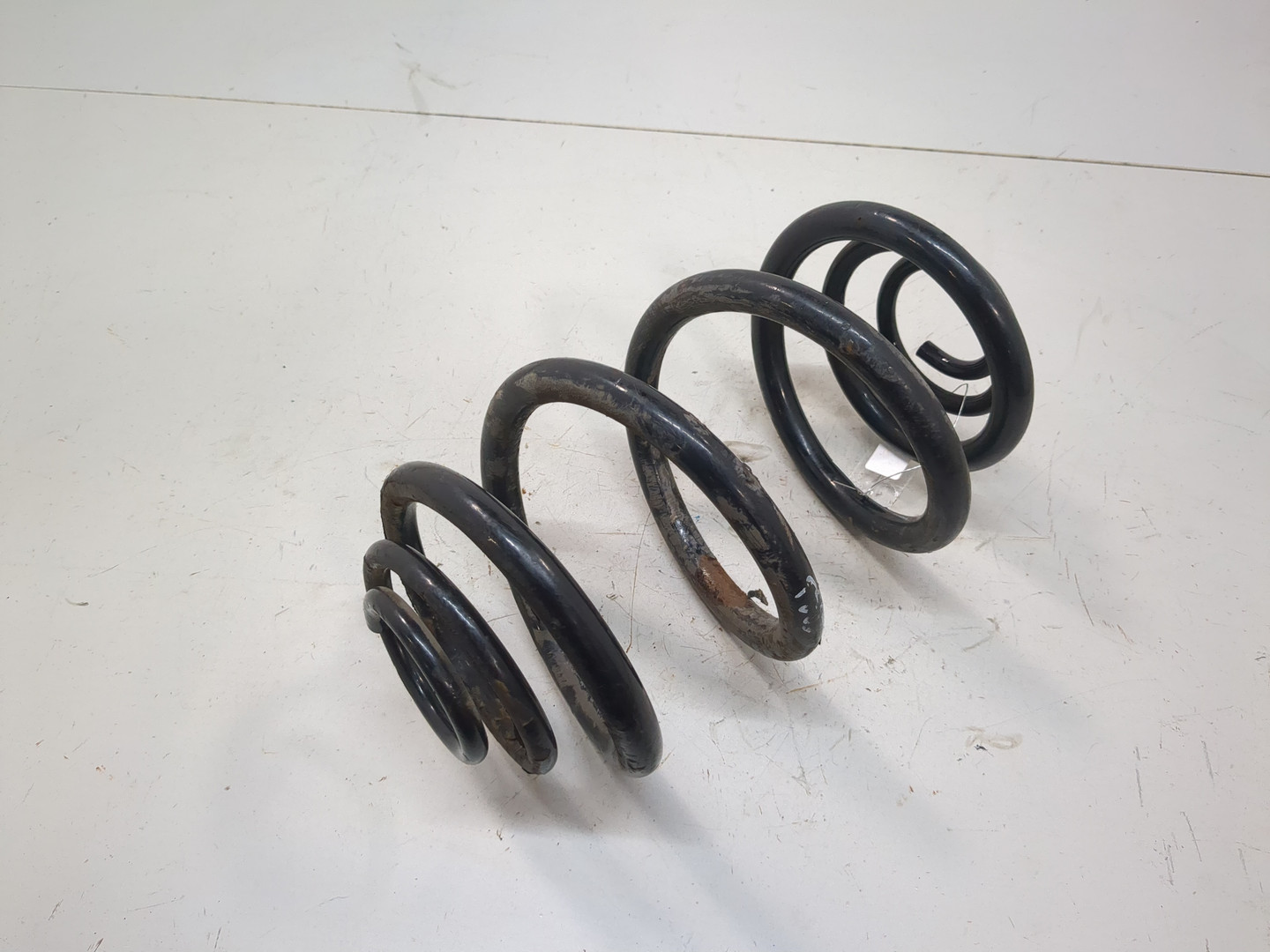 Пружина задняя