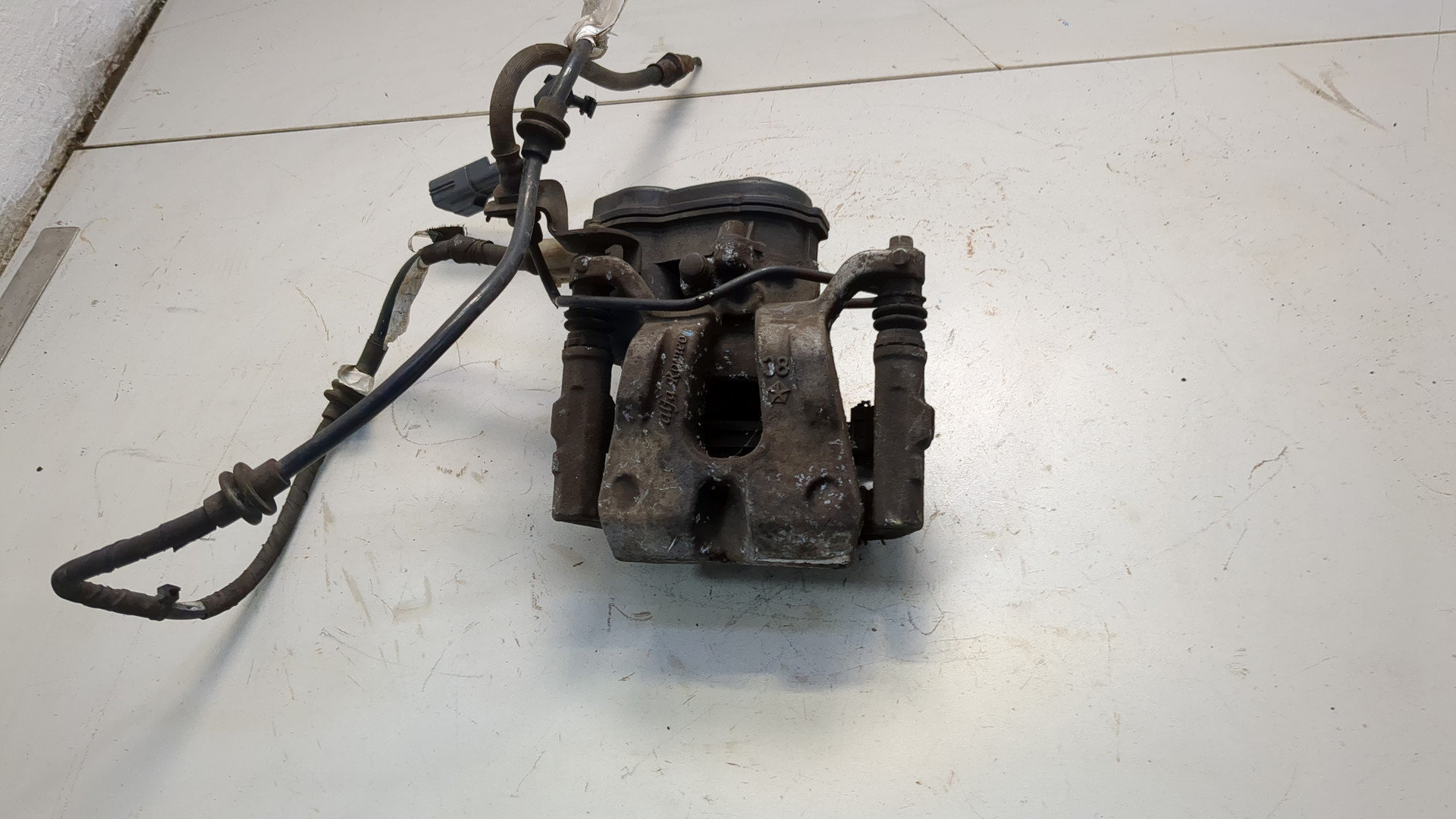 Суппорт задний левый