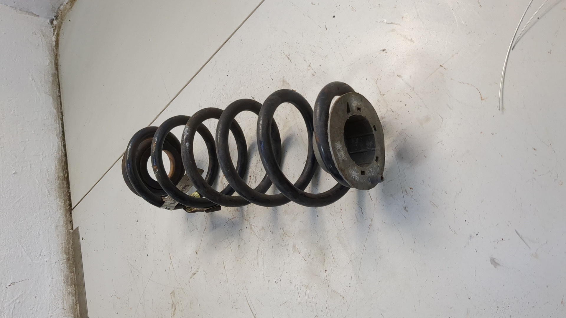 Пружина задняя