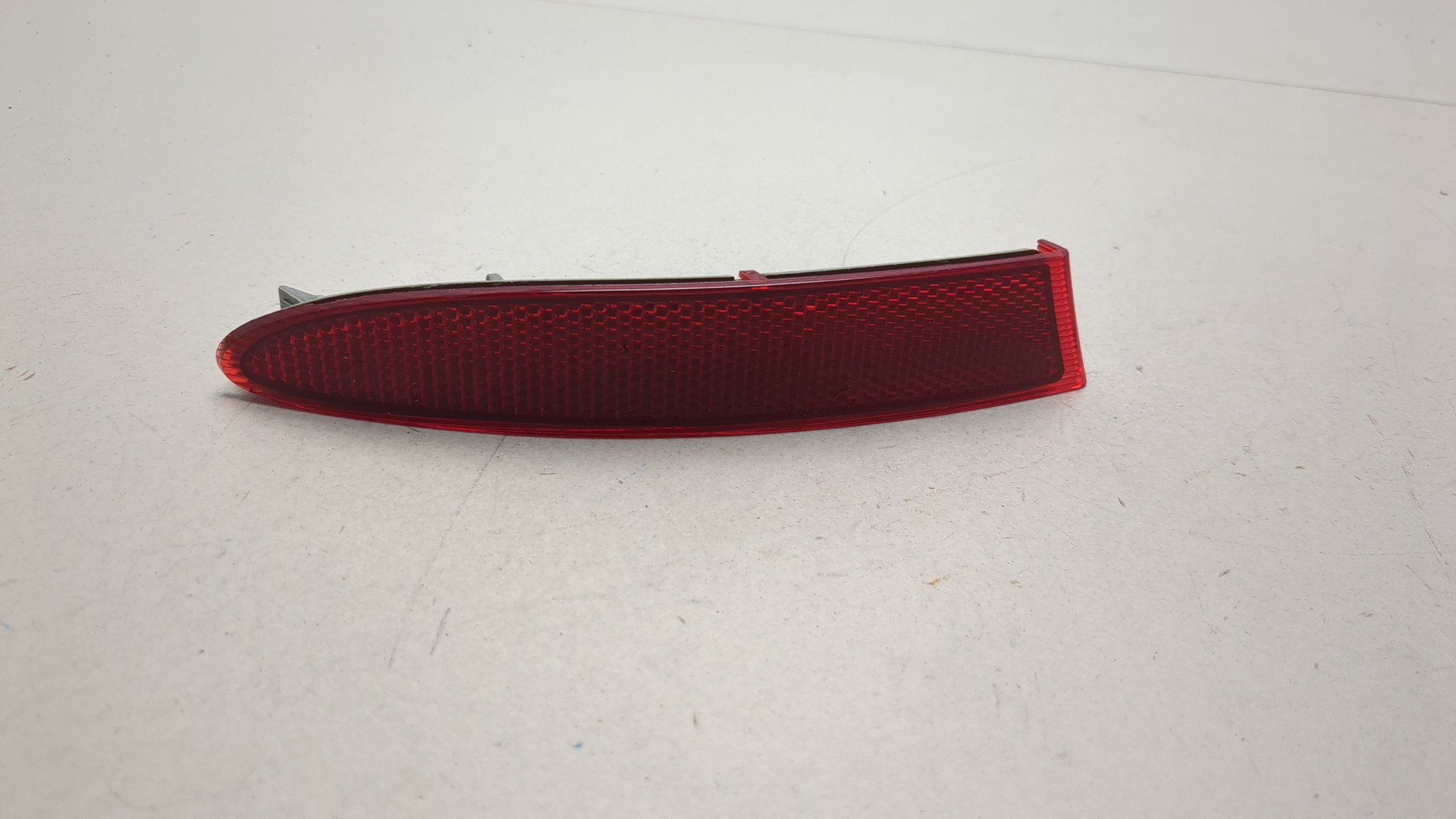 Отражатель в бампер задний левый