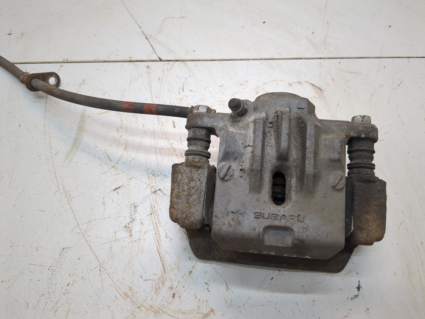 Суппорт задний левый