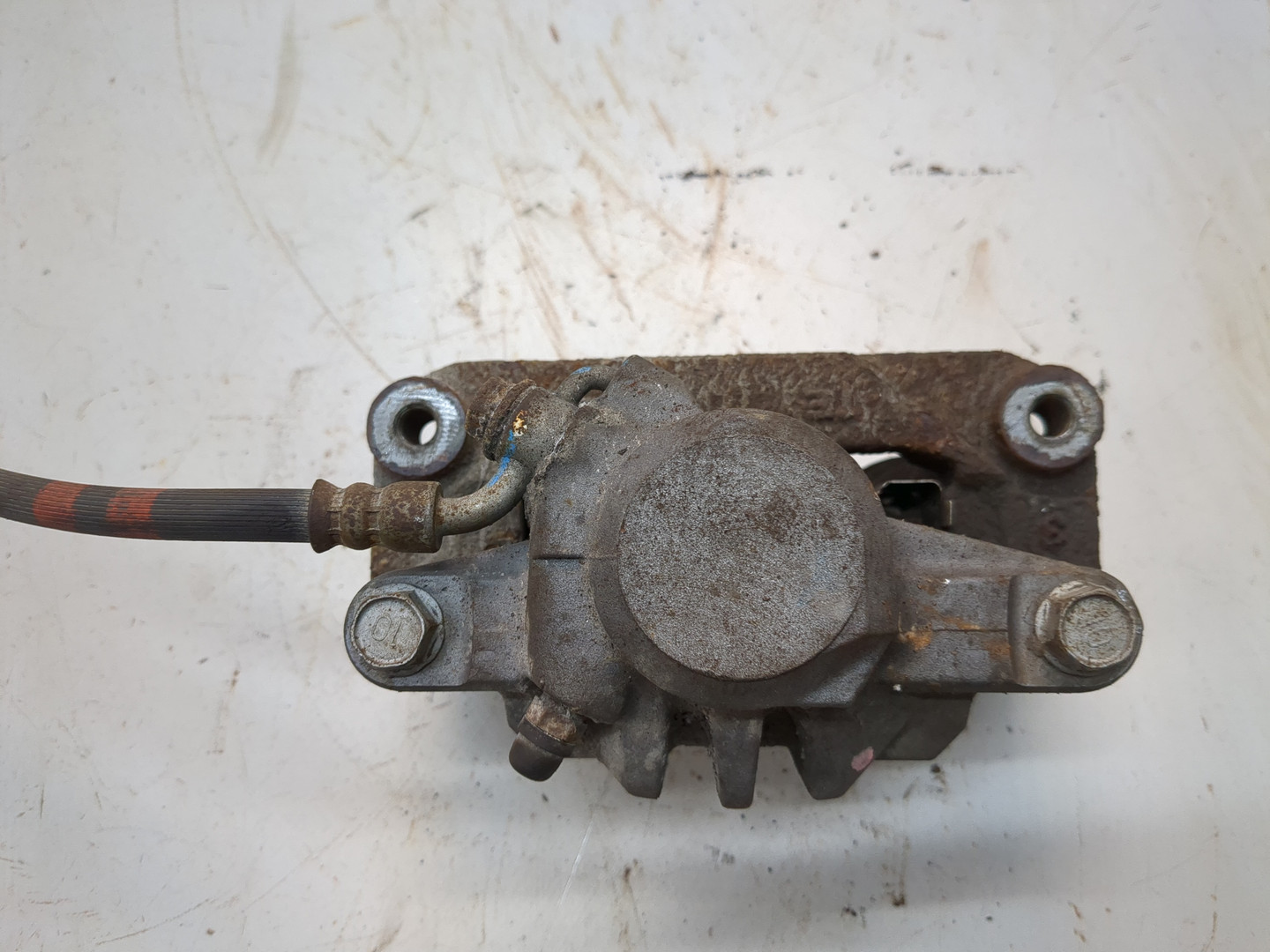 Суппорт задний левый