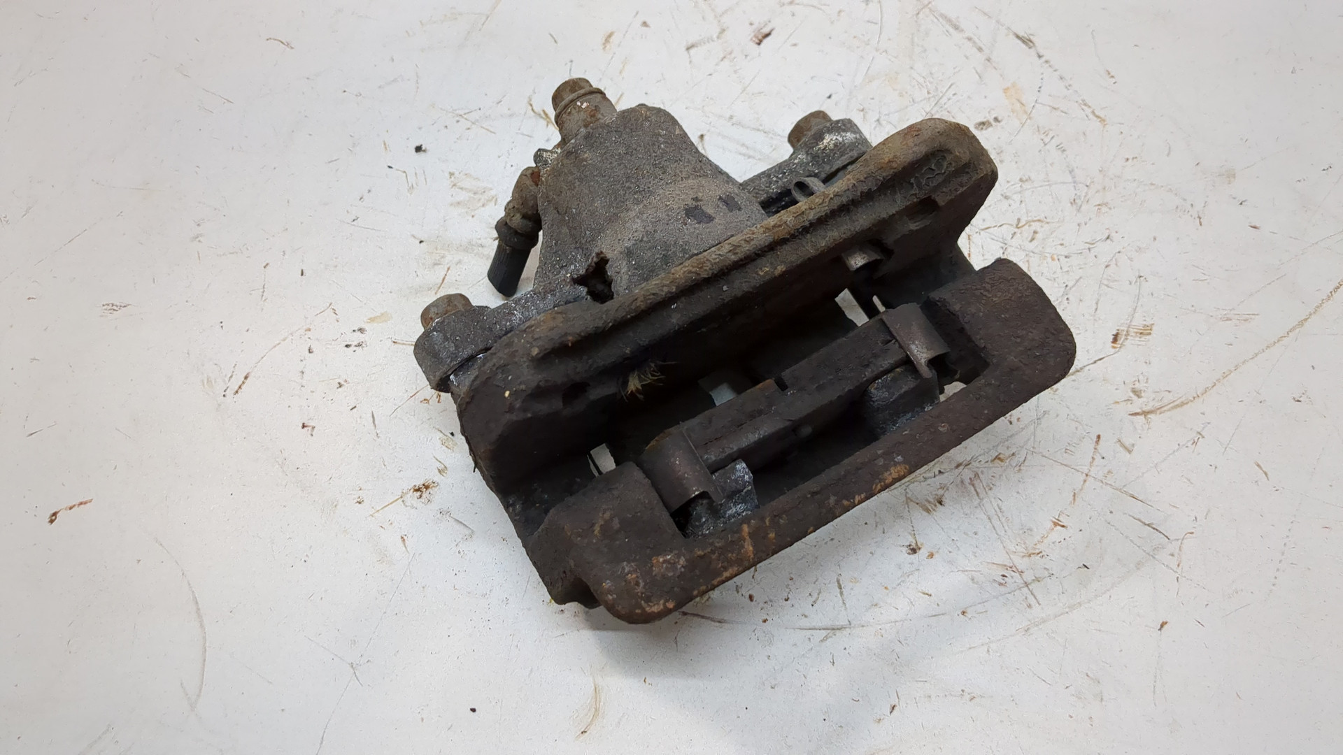 Суппорт задний левый