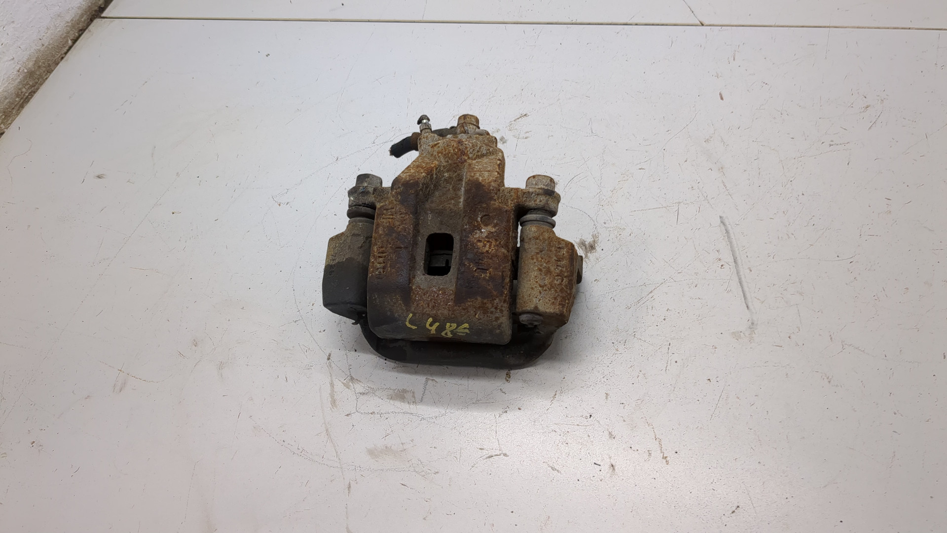 Суппорт задний левый