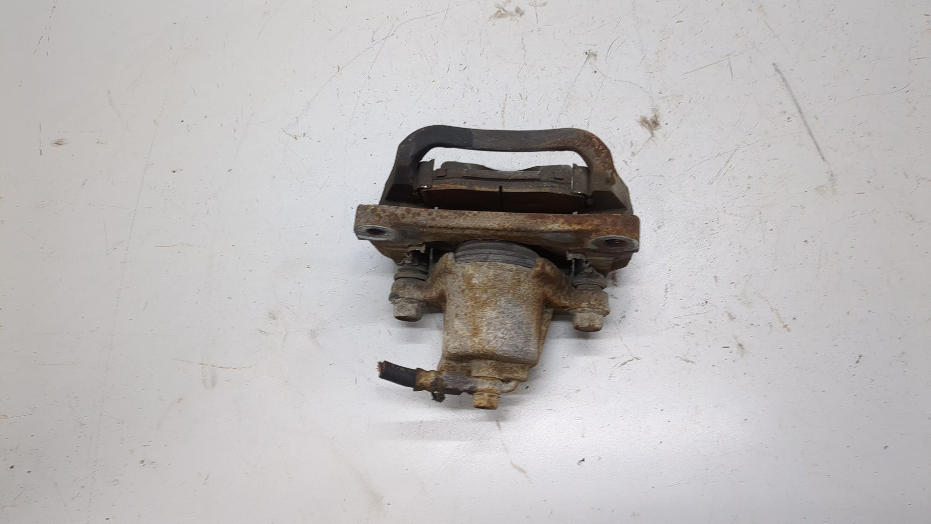 Суппорт задний левый