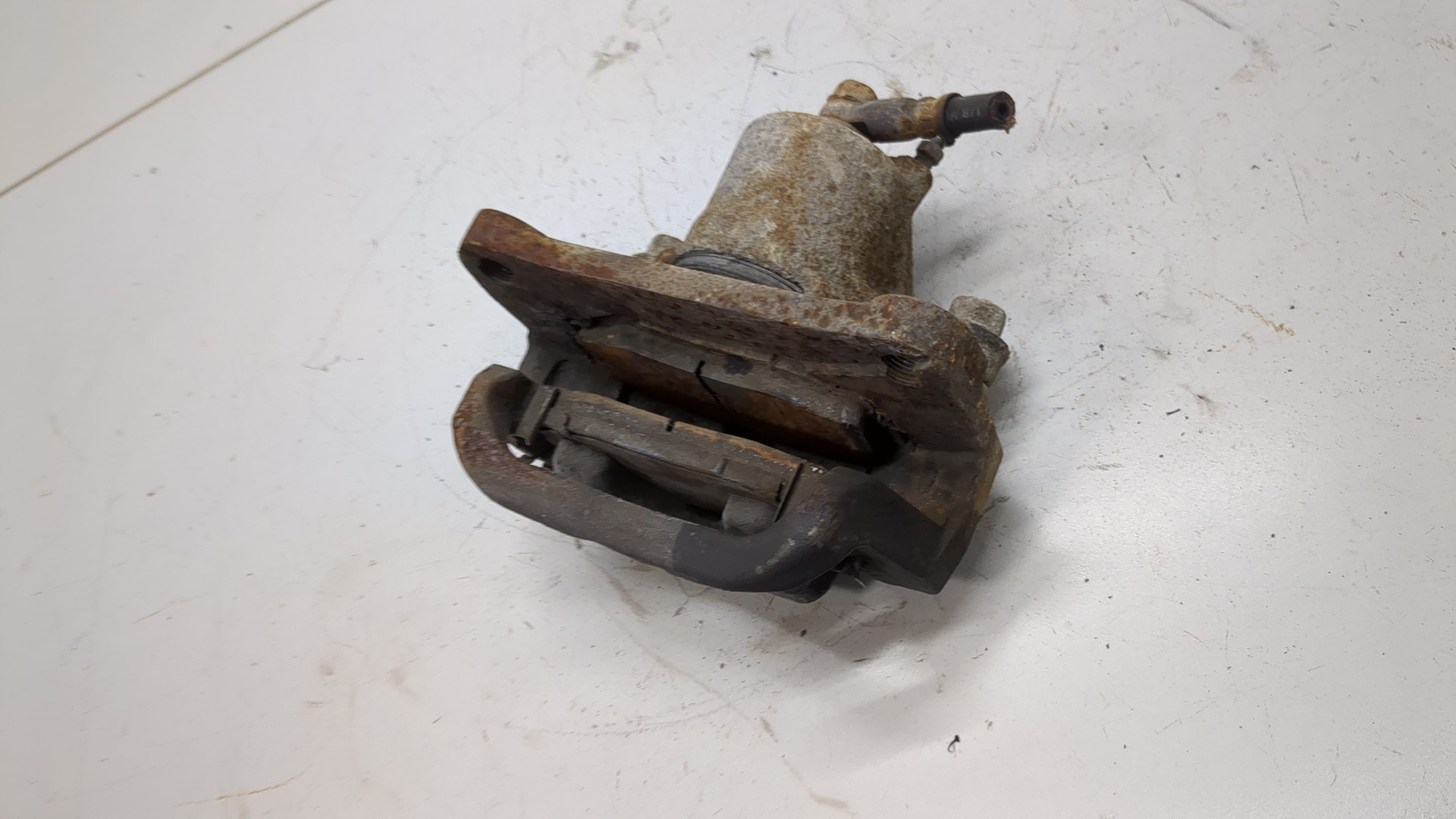 Суппорт задний левый