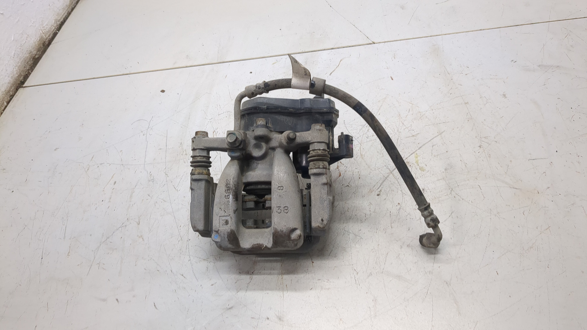 Суппорт задний левый