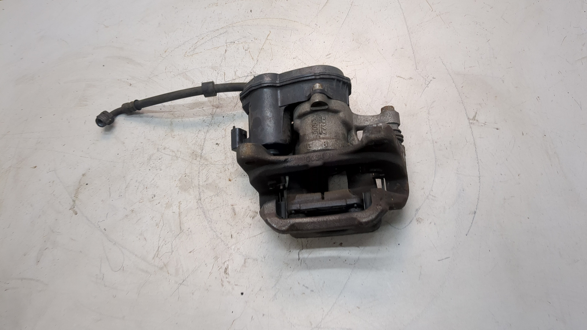 Суппорт задний левый