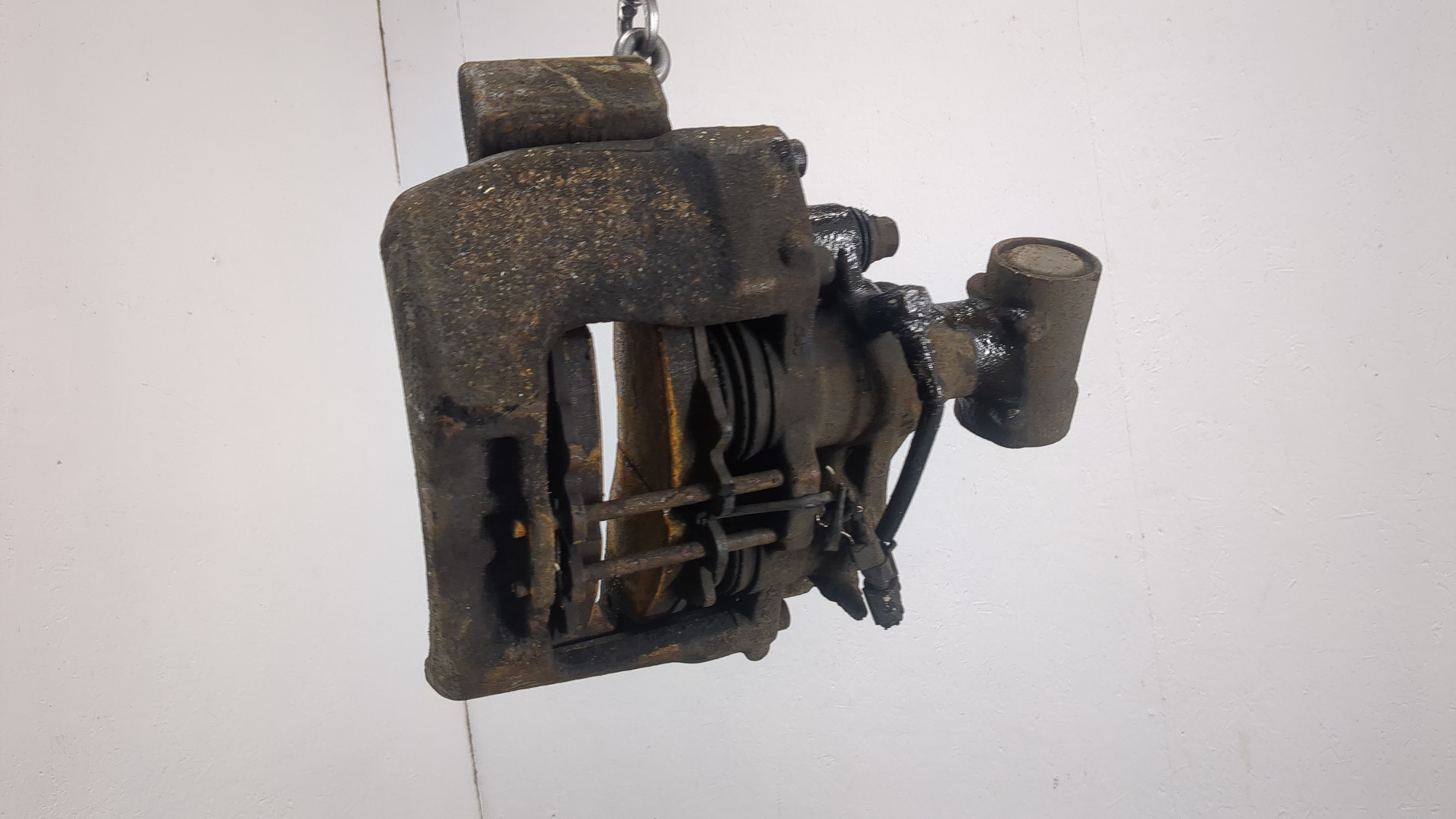 Суппорт задний левый