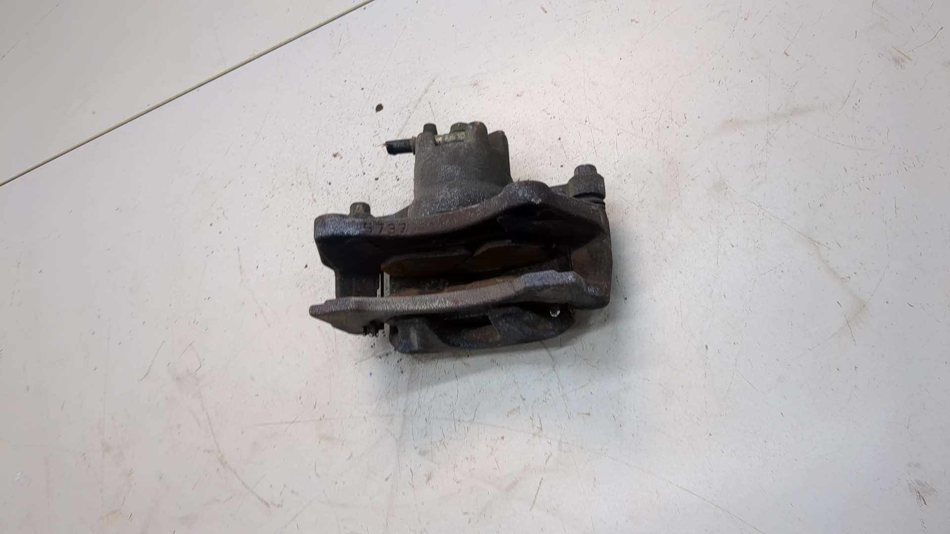 Суппорт передний левый