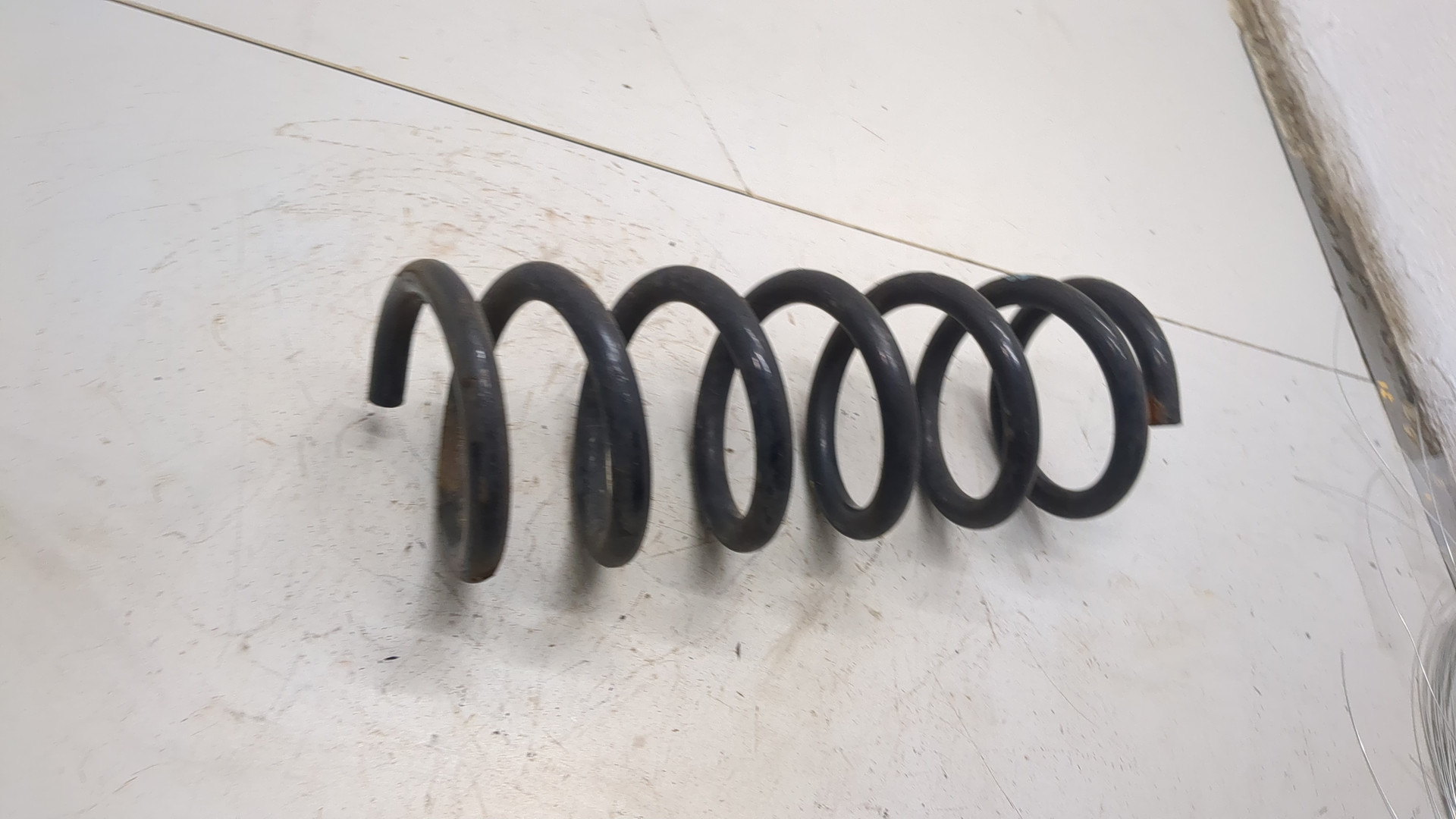 Пружина задняя