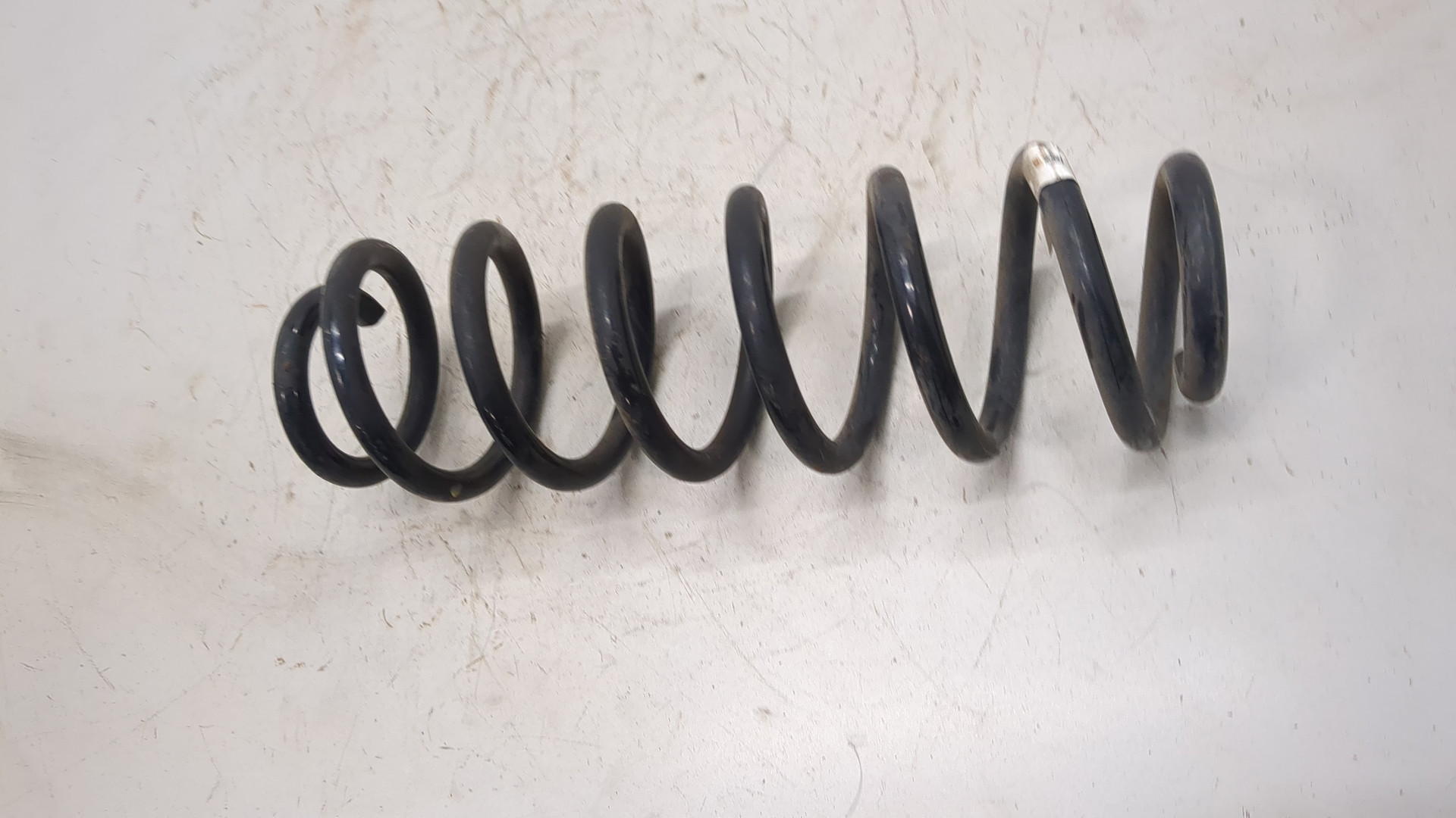 Пружина задняя