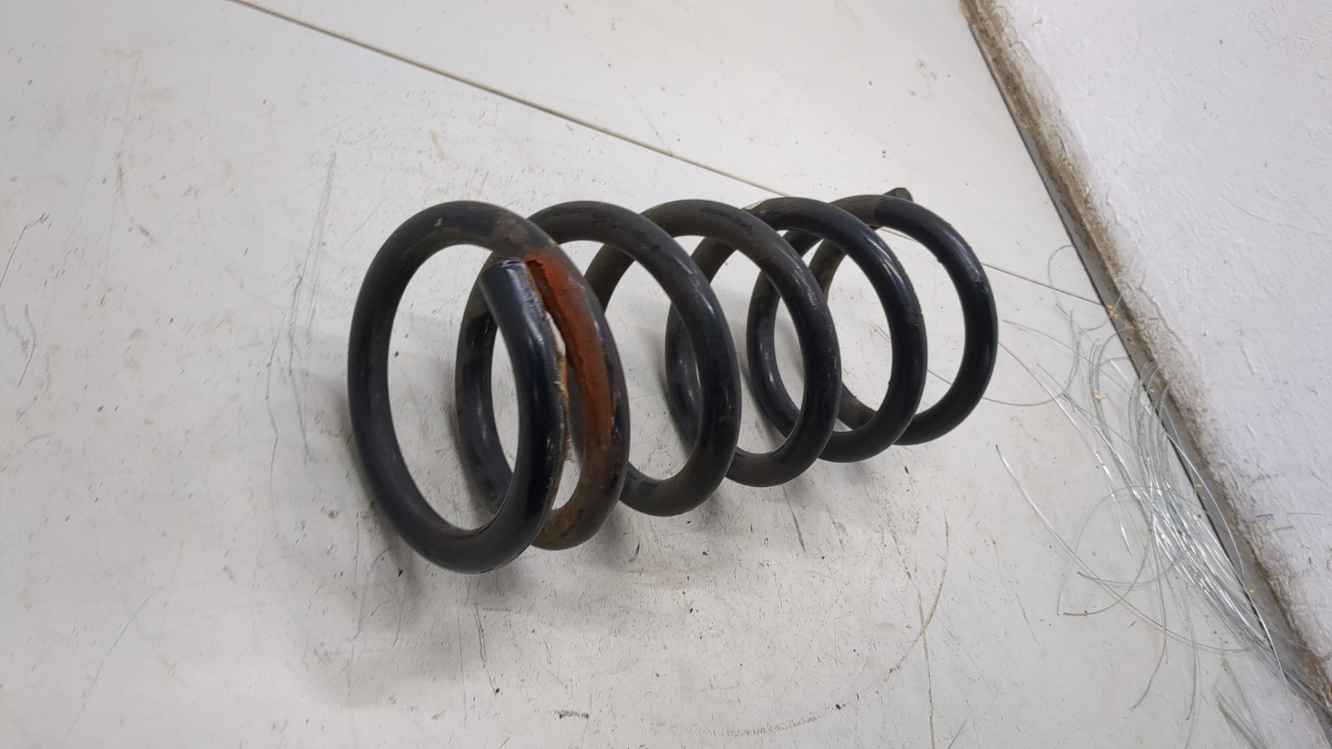 Пружина задняя