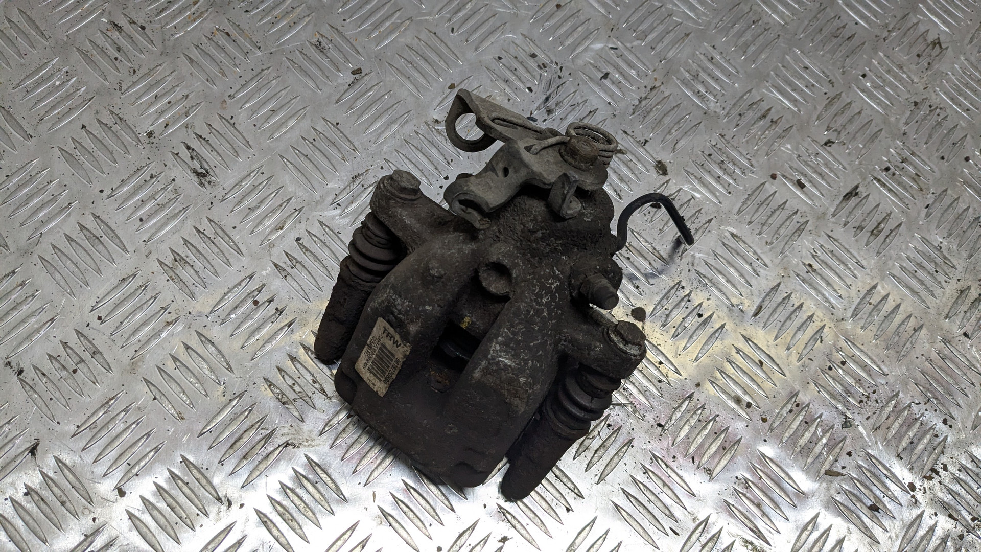 Суппорт задний левый