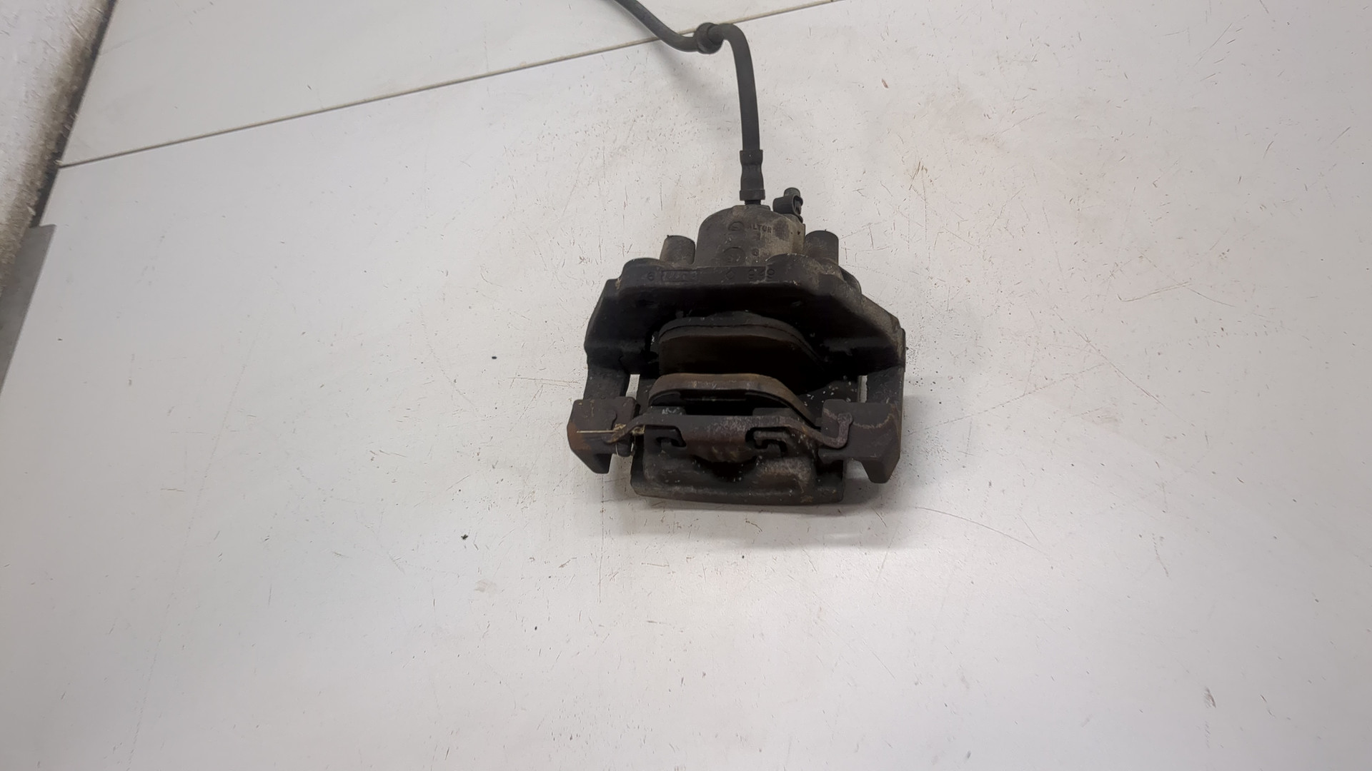 Суппорт задний левый