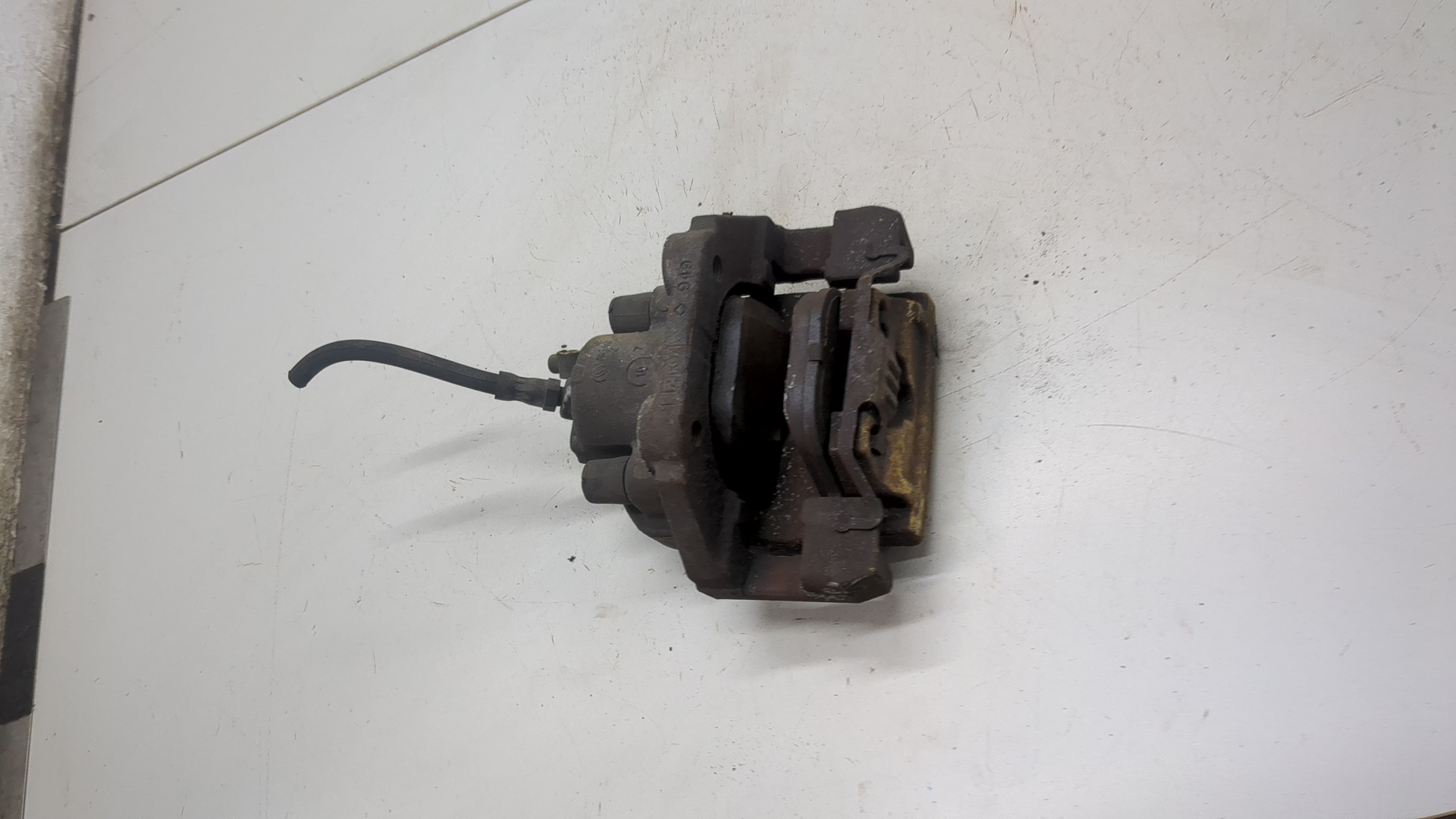 Суппорт задний левый