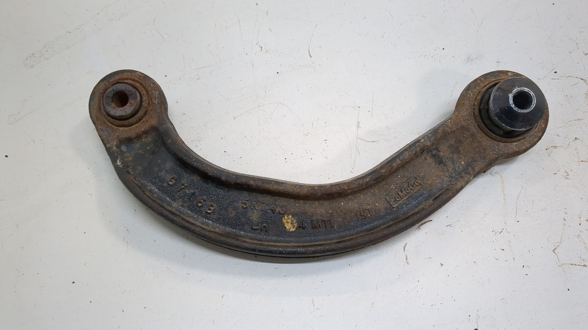 Рычаг задний левый