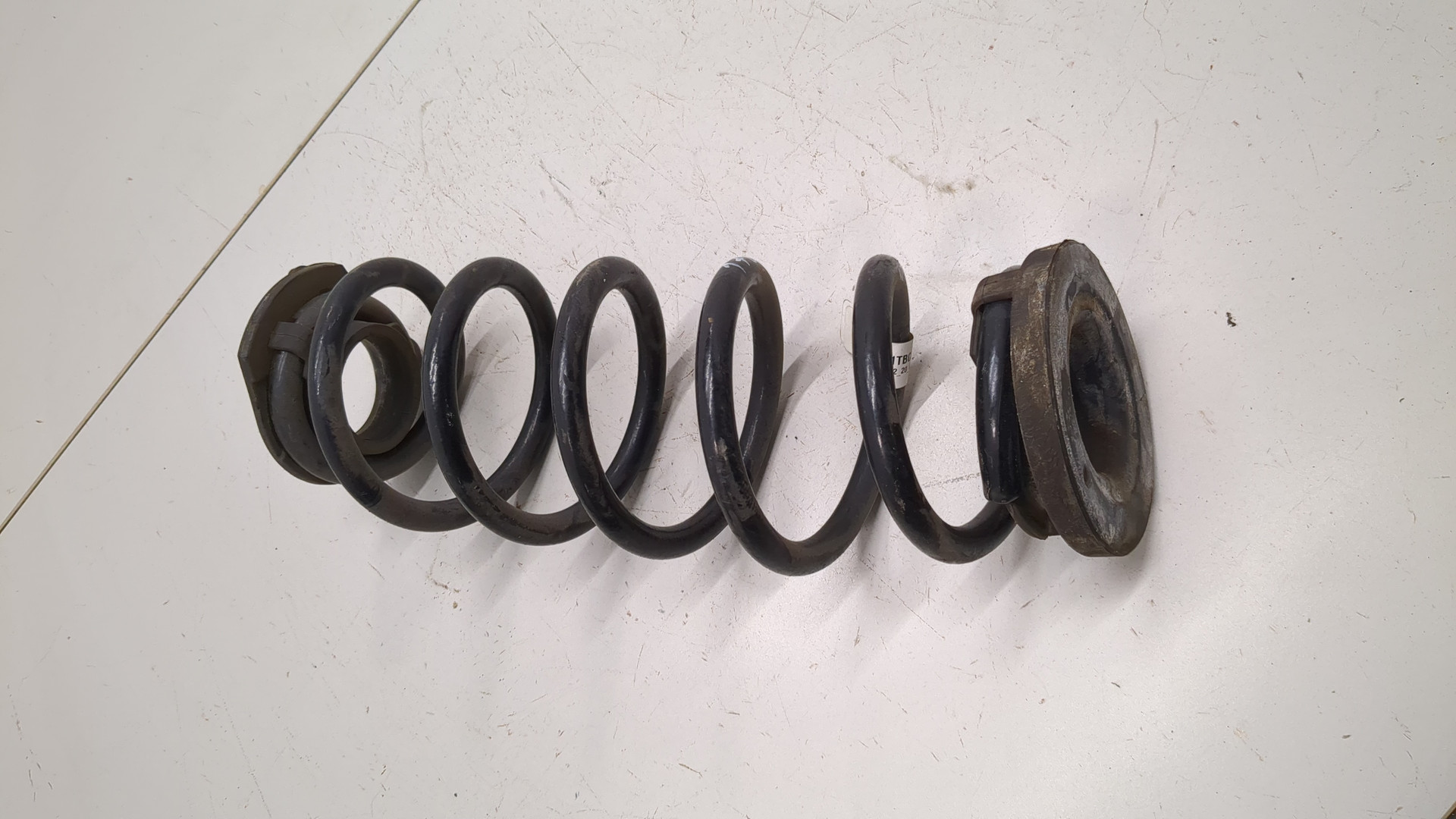 Пружина задняя