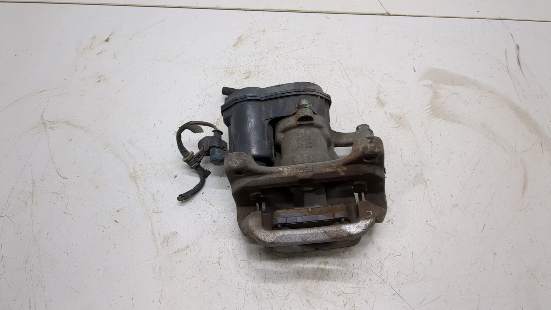 Суппорт задний левый