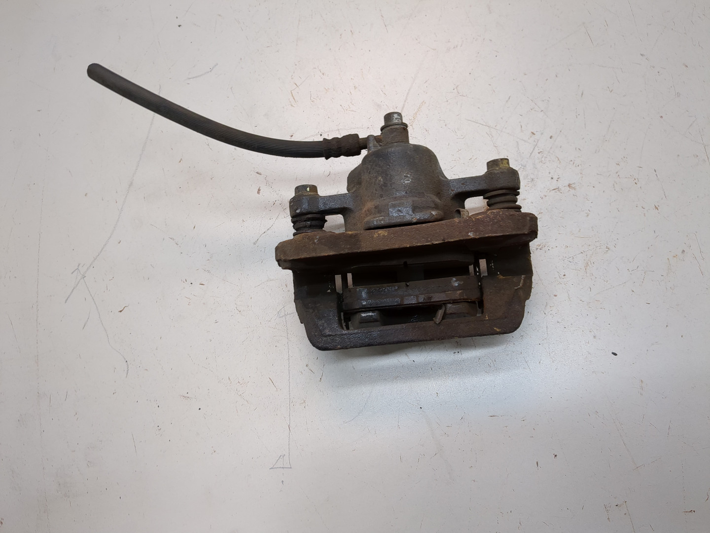 Суппорт задний левый