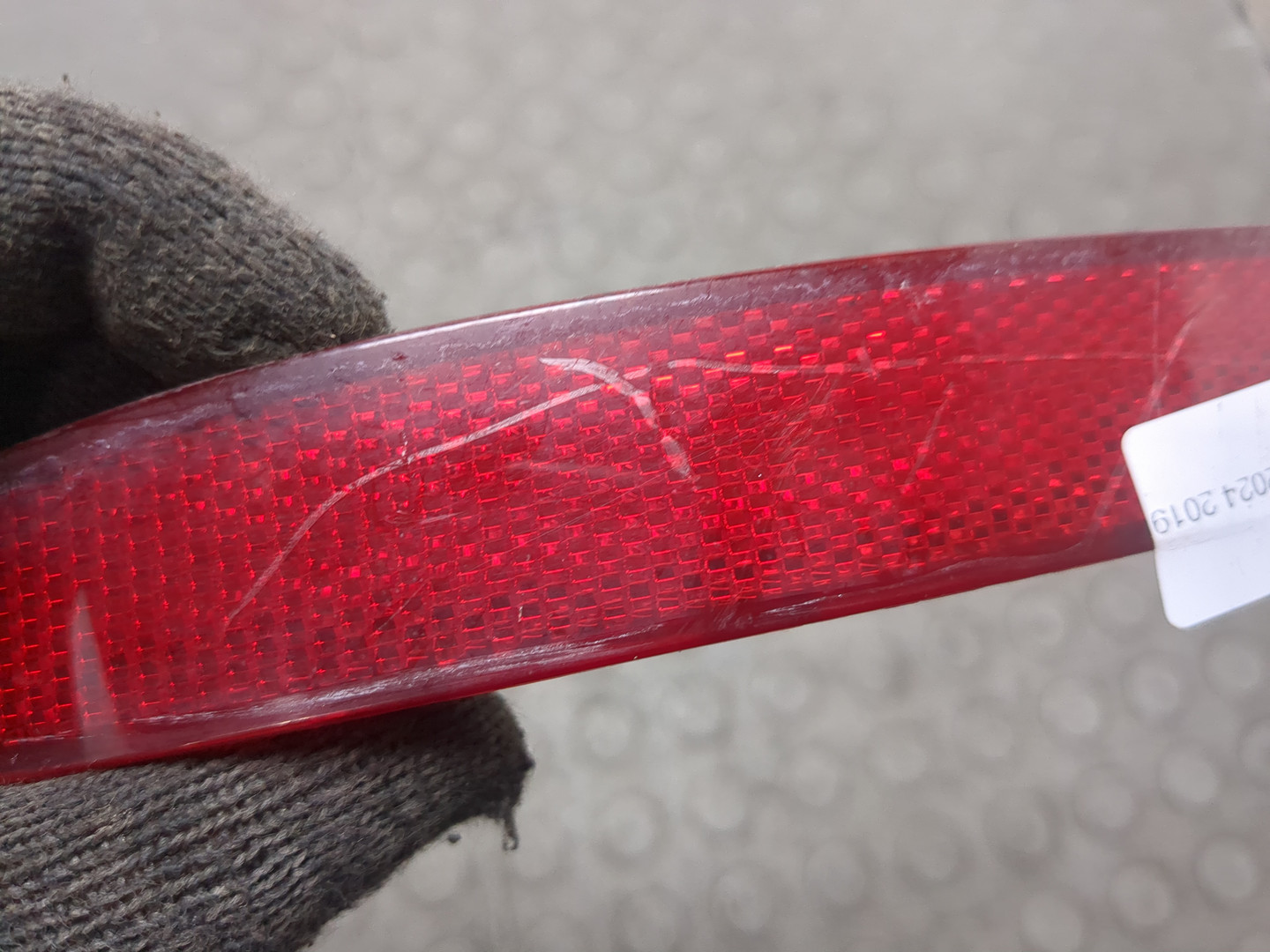 Отражатель в бампер задний левый