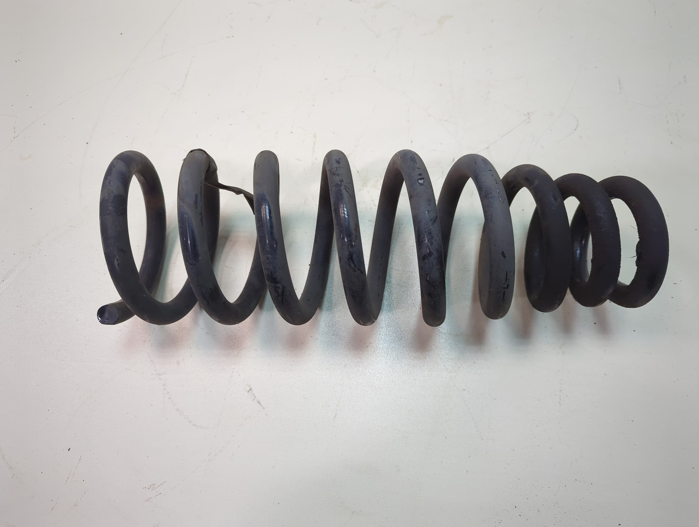 Пружина задняя