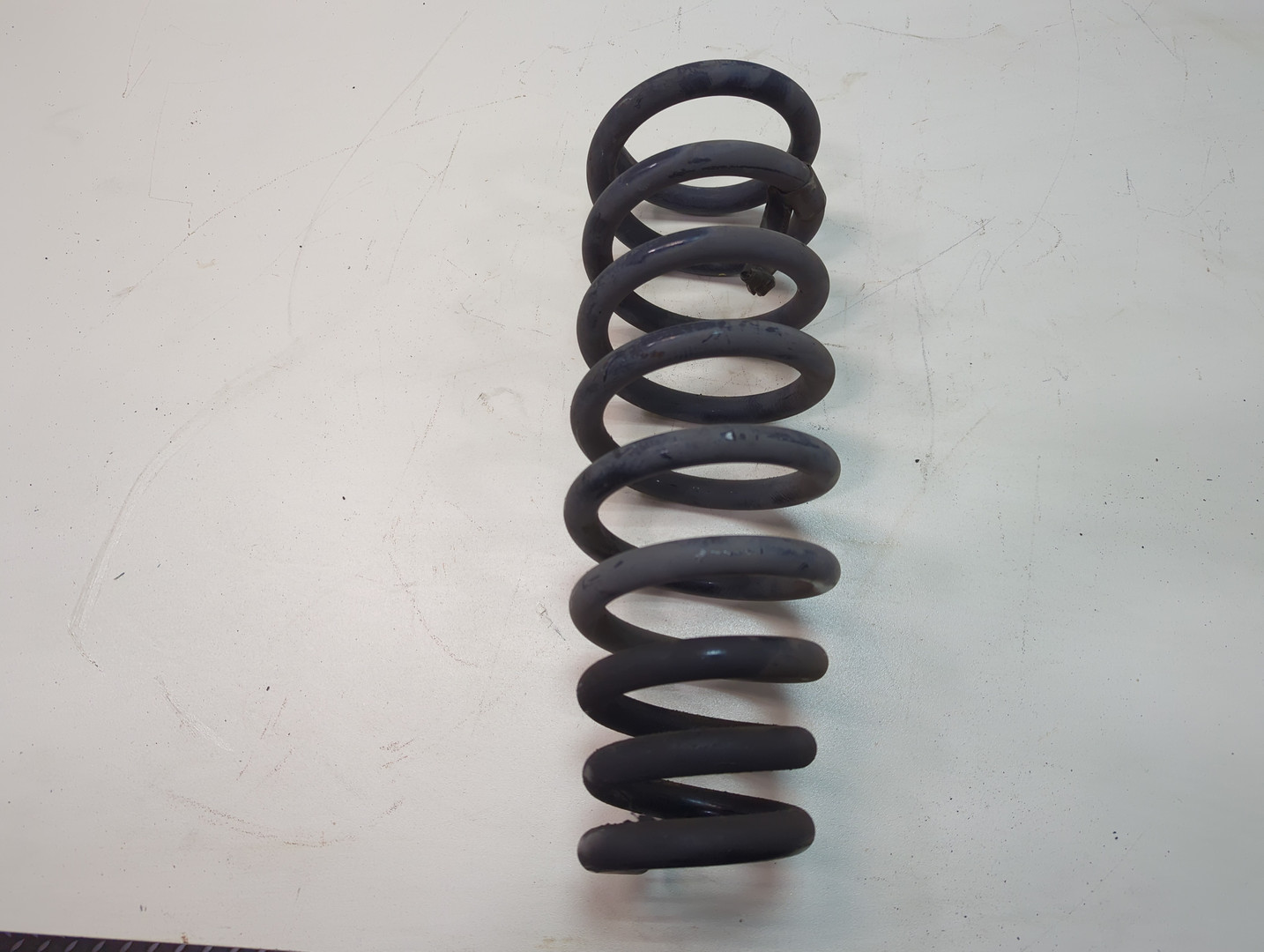 Пружина задняя