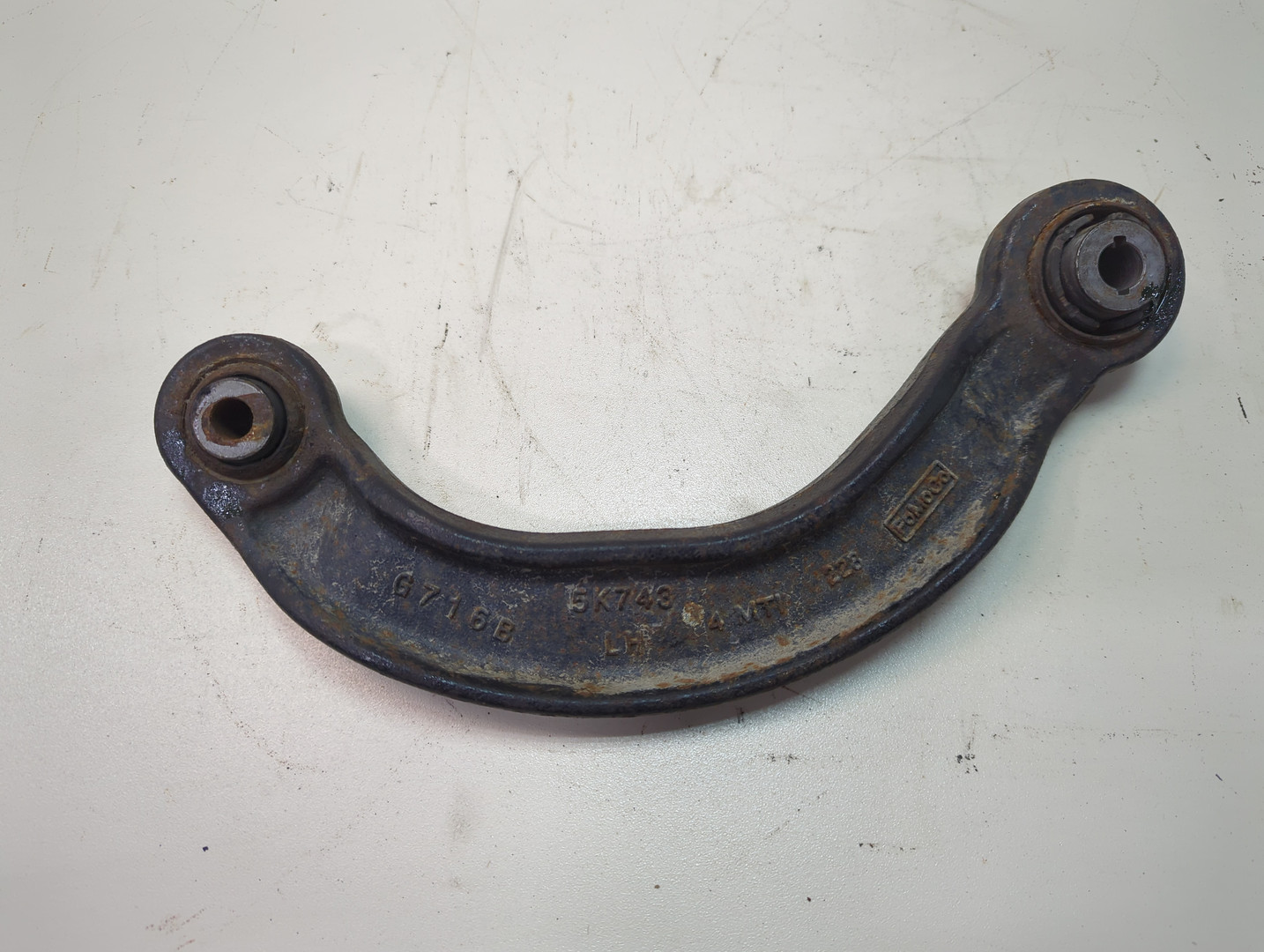 Рычаг задний левый