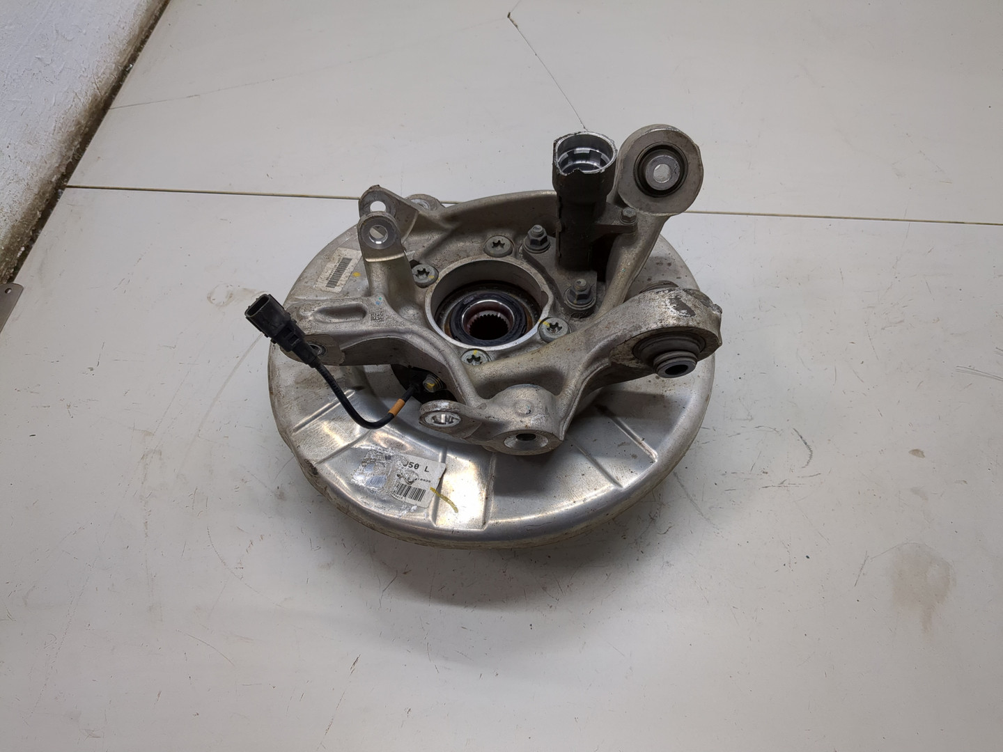 Кулак поворотный задний левый