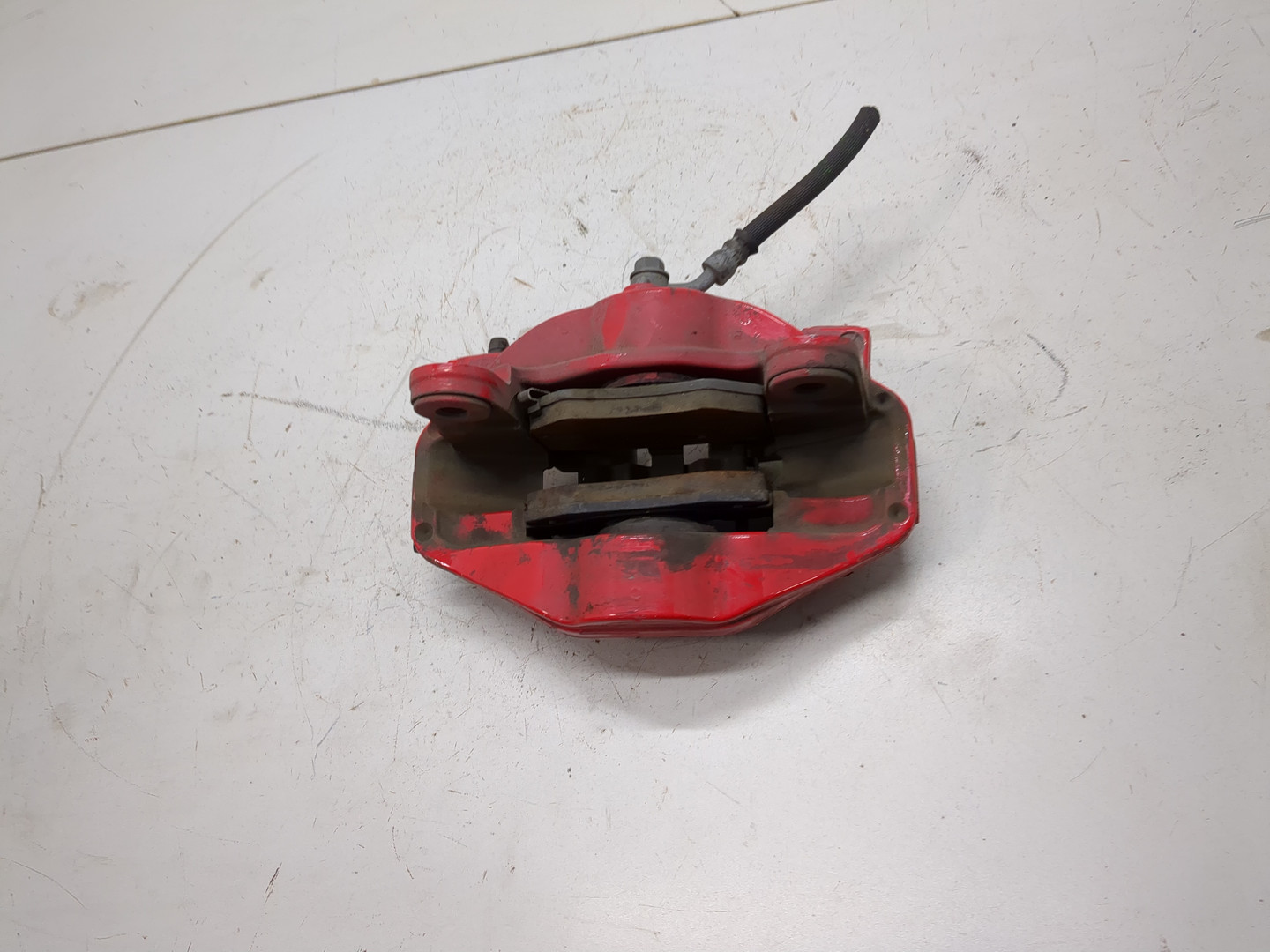 Суппорт задний левый