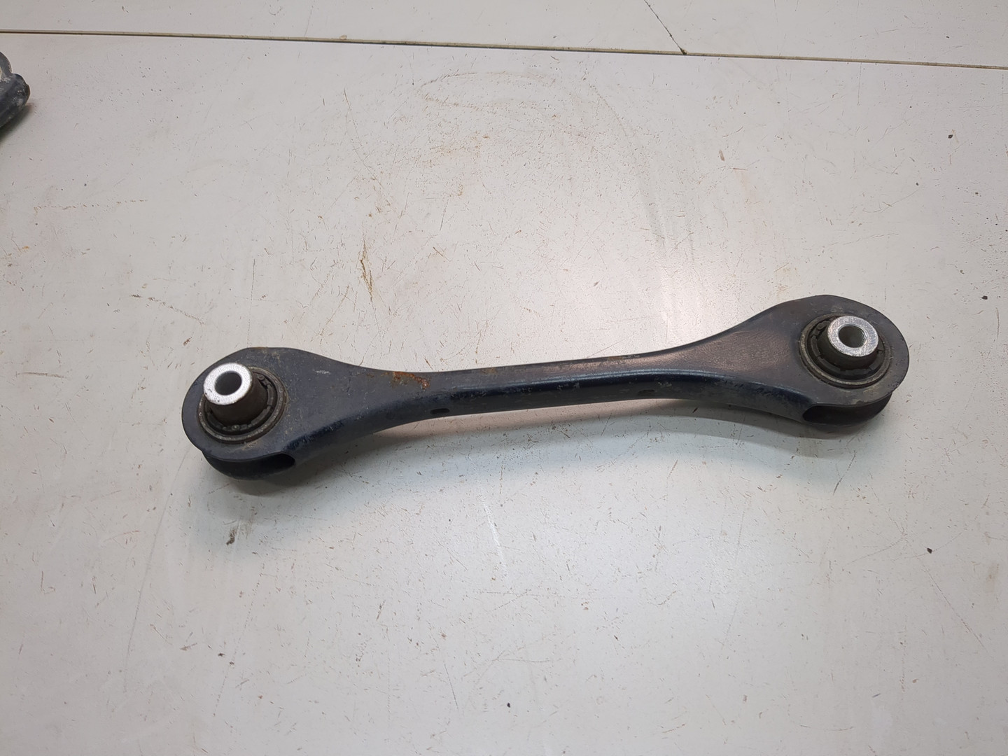 Рычаг задний левый