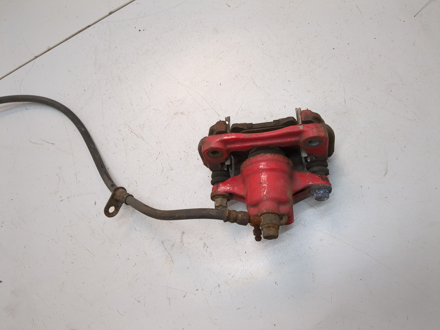 Суппорт задний левый