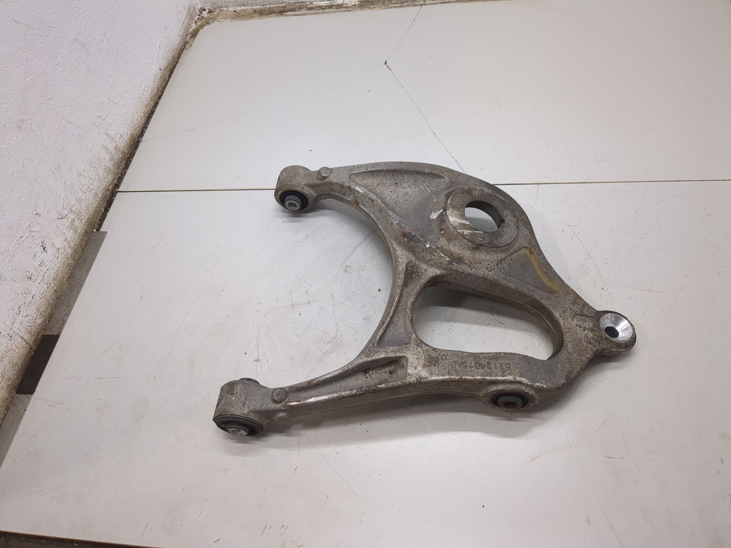 Рычаг задний левый