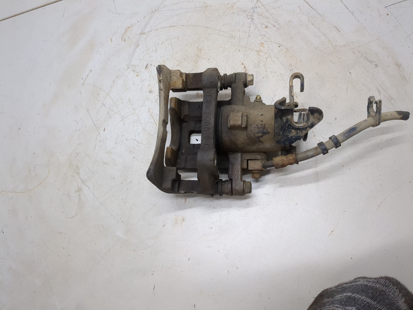 Суппорт задний левый