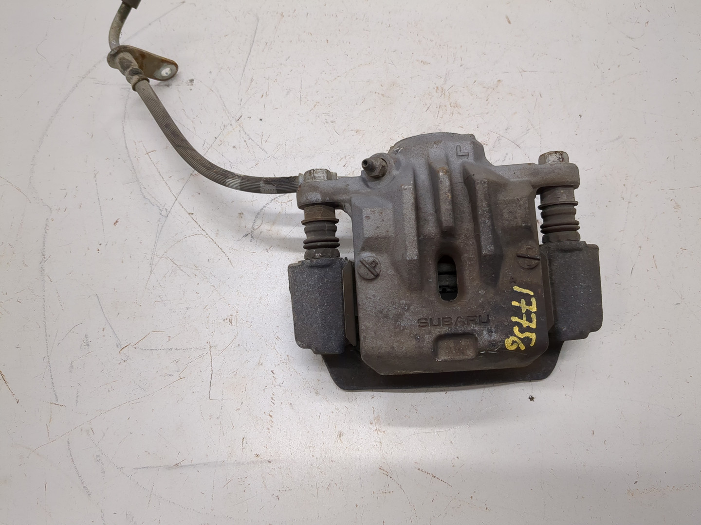 Суппорт задний левый