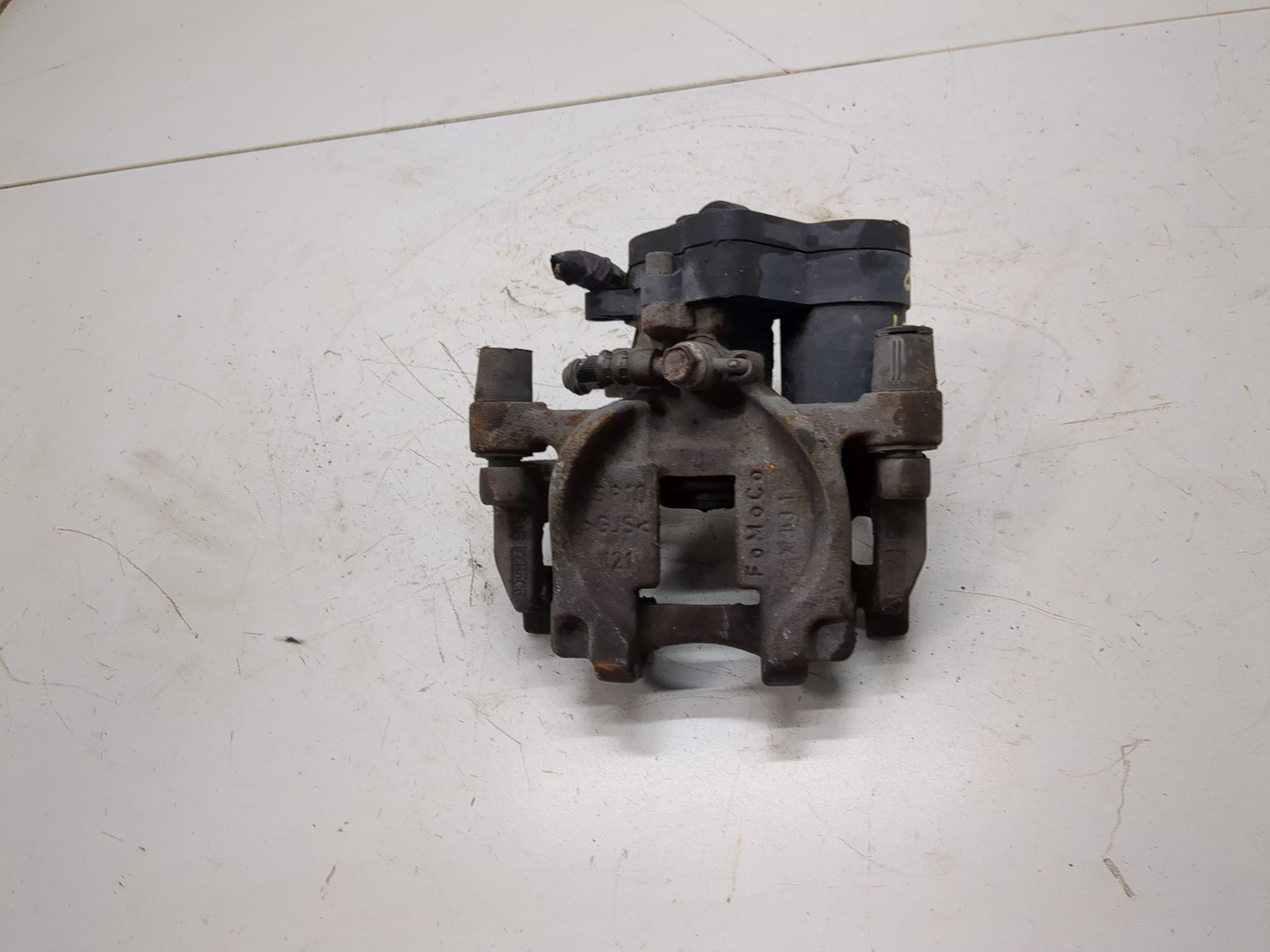 Суппорт задний левый