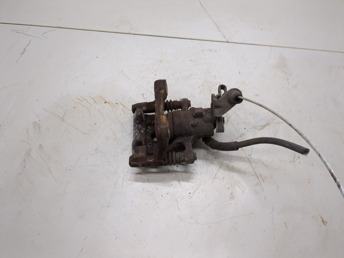 Суппорт задний левый