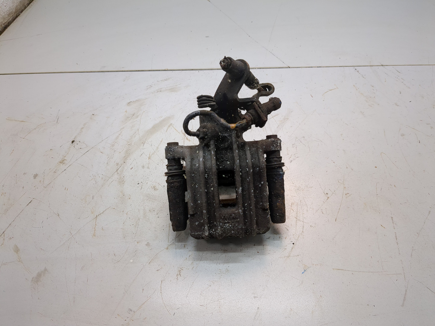 Суппорт задний левый