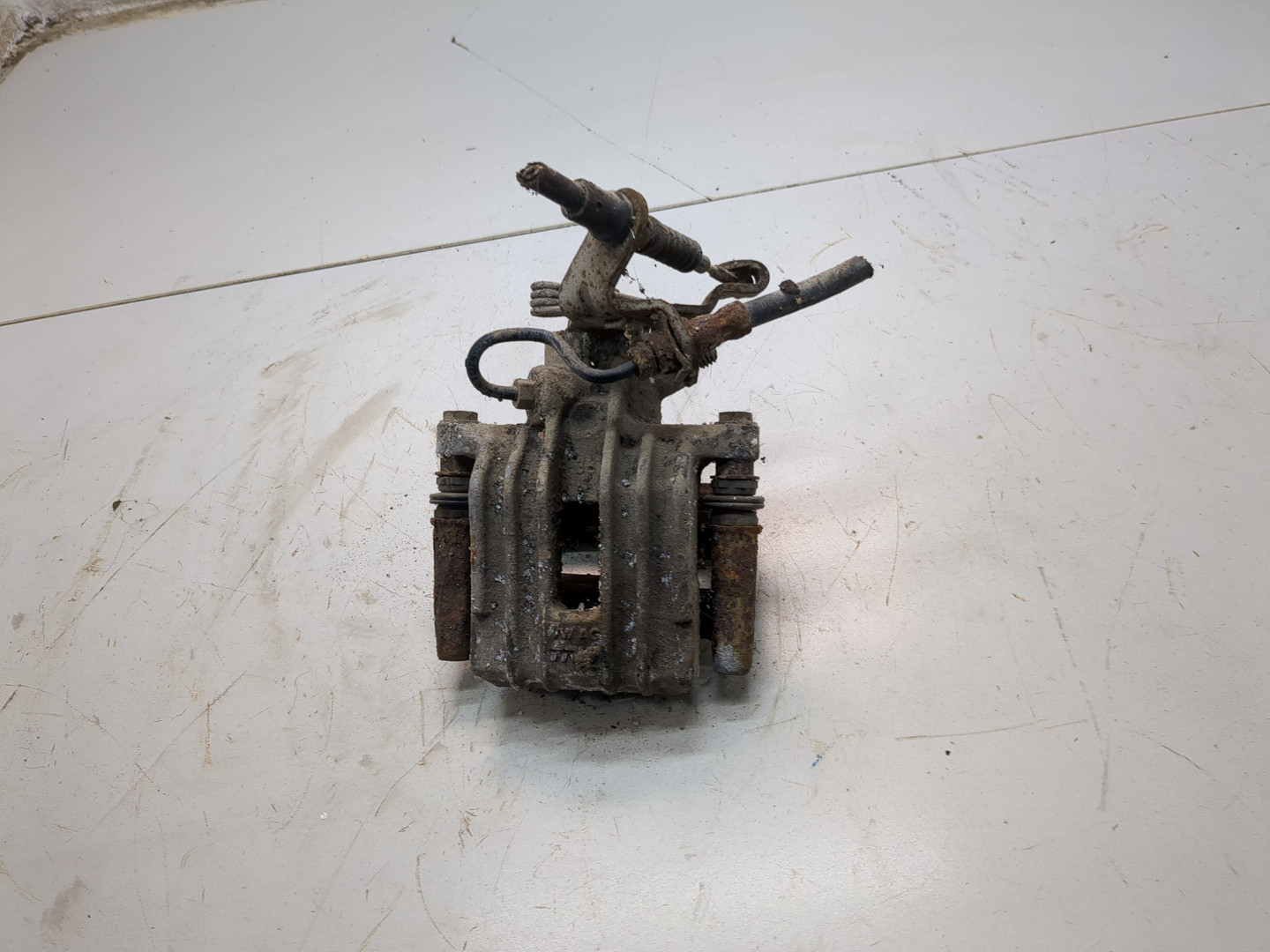 Суппорт задний левый