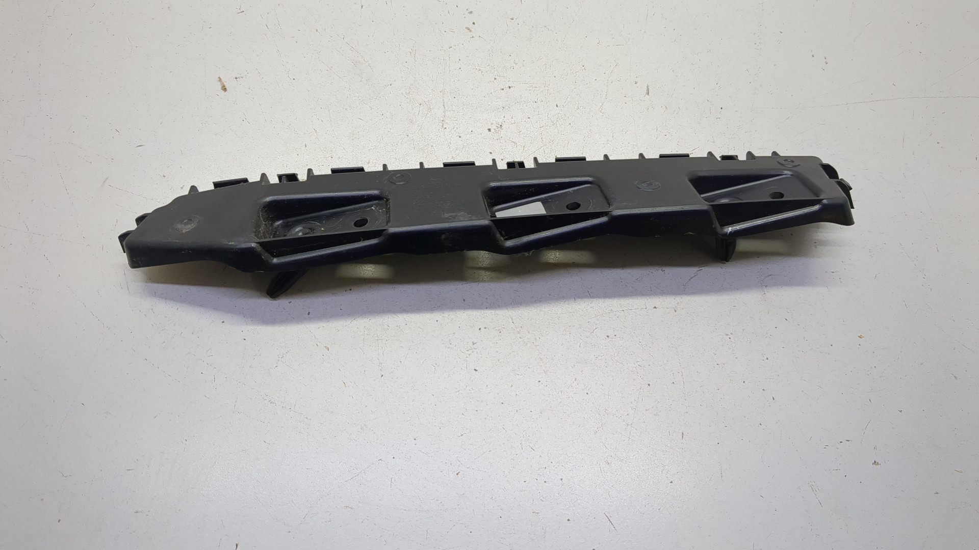 Кронштейн заднего бампера левый