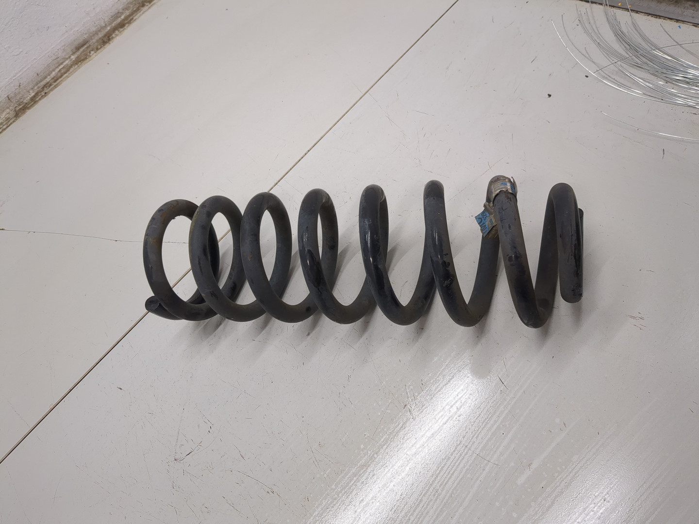 Пружина задняя