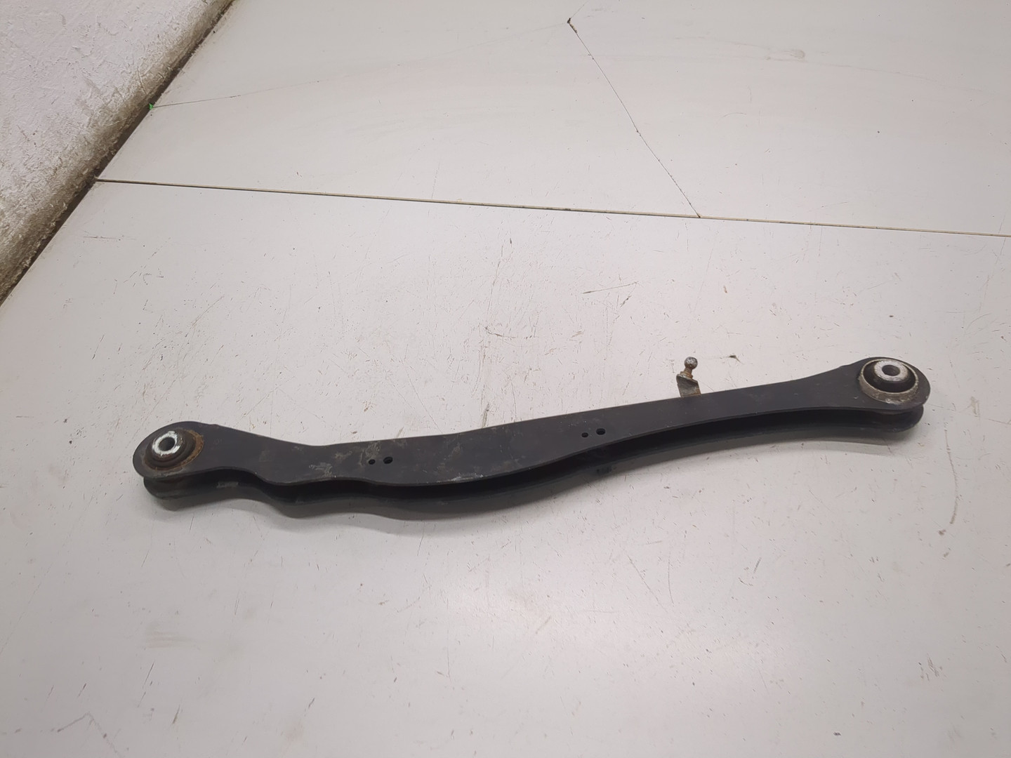 Рычаг задний левый